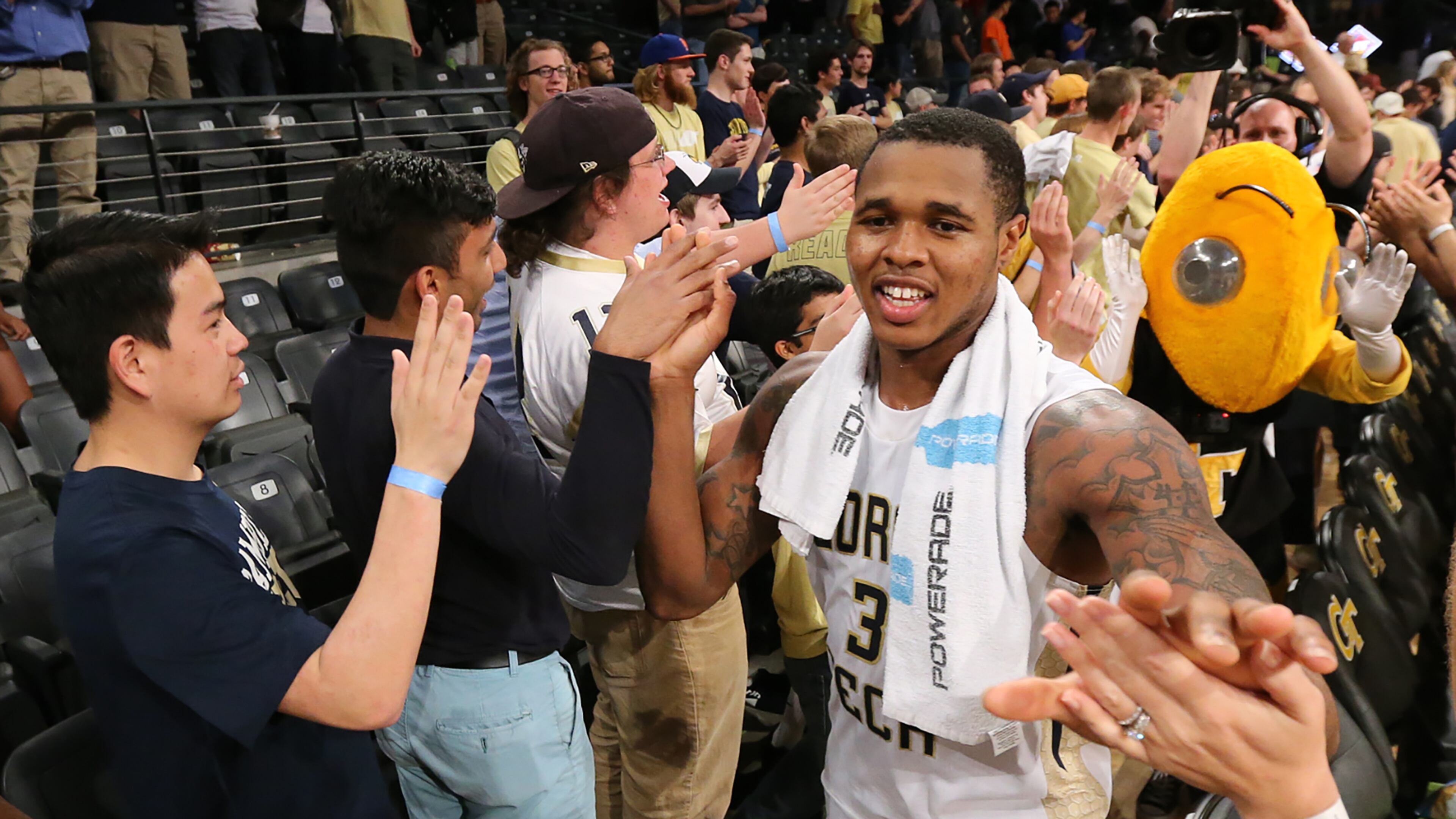 Georgia Tech guard Marcus Georges-Hunt celebrates with fans after beating Houston 81-62 in the Yellow Jackets’ first-round NIT basketball game on Wednesday at McCamish Pavilion. Curtis Compton / ccompton@ajc.com