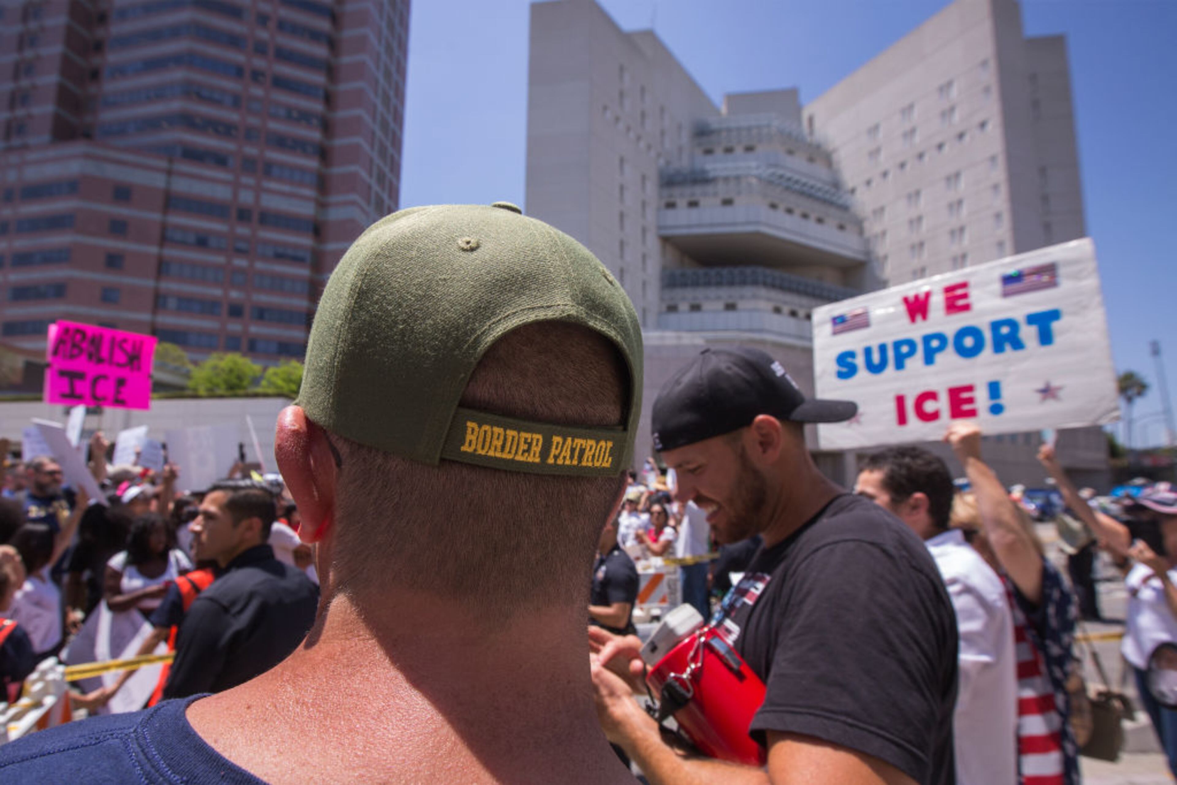 LOS ANGELES, CA - JUNE 30: Pro-Trump counter demonstrators face protesters decrying Trump administration immigration and refugee policies on June 30, 2018 in Los Angeles, California. Although President Trump was forced to reverse his policy of removing all children from their immigrant or asylum-seeking parents, little clarity appears to be seen as to how agencies can fulfill a court order to reunite thousands of children and parents detained far apart by multiple agencies. Yesterday, the Justice Department filed papers in a Los Angeles federal court to have families arrested for illegal border crossings incarcerated together indefinitely. The rally is one of more than 700 such protests being held throughout the nation. (Photo by David McNew/Getty Images)