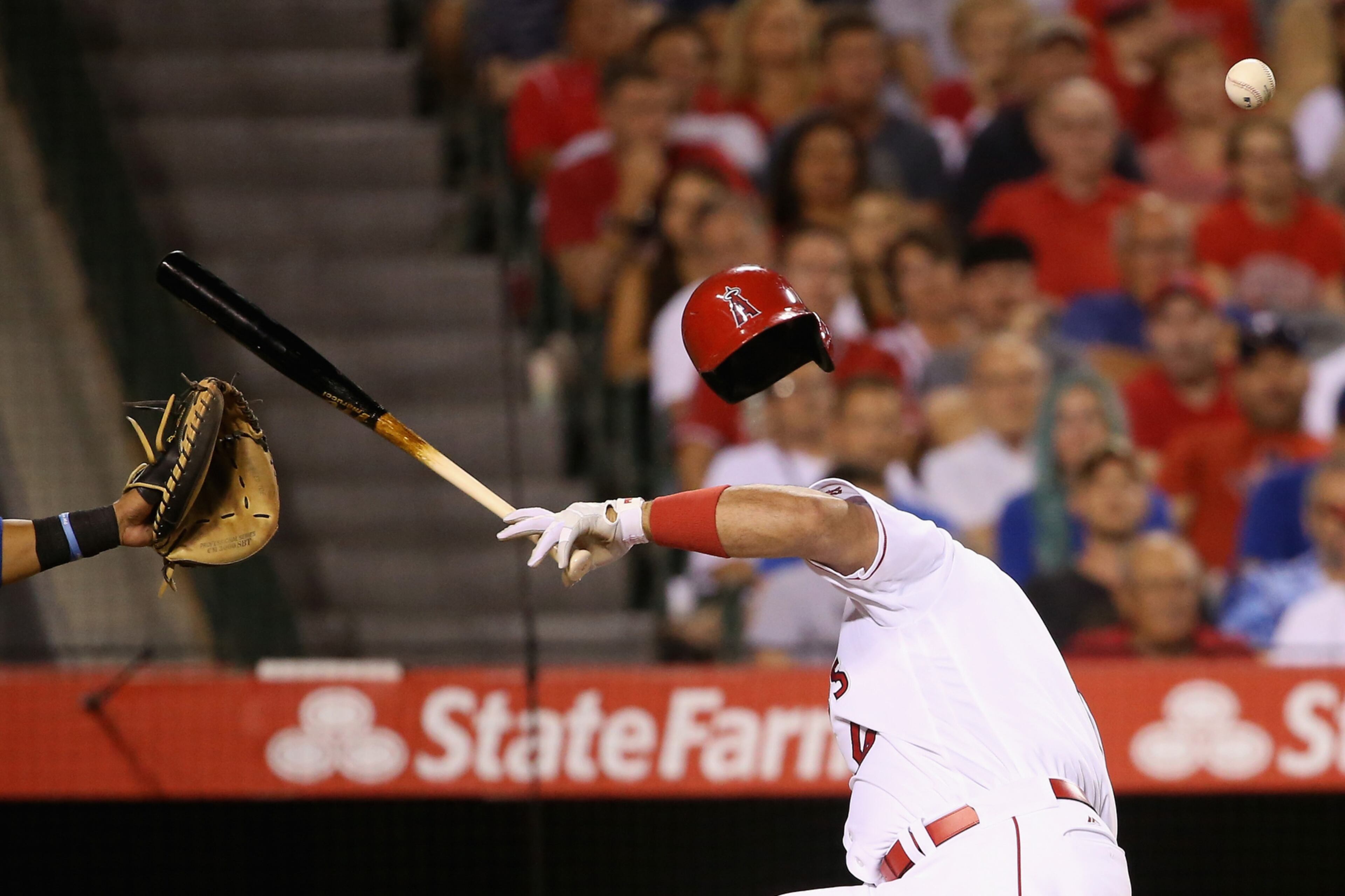 ANAHEIM, CA - JULY 19: Albert Pujols #5 of the Los Angeles Angels of Anaheim reacts to being hit in the head by a pitch from Tony Barnette #43 of the Texas Rangers during the seventh inning of a baseball game at Angel Stadium of Anaheim on July 19, 2016 in Anaheim, California. (Photo by Sean M. Haffey/Getty Images) *** BESTPIX ***