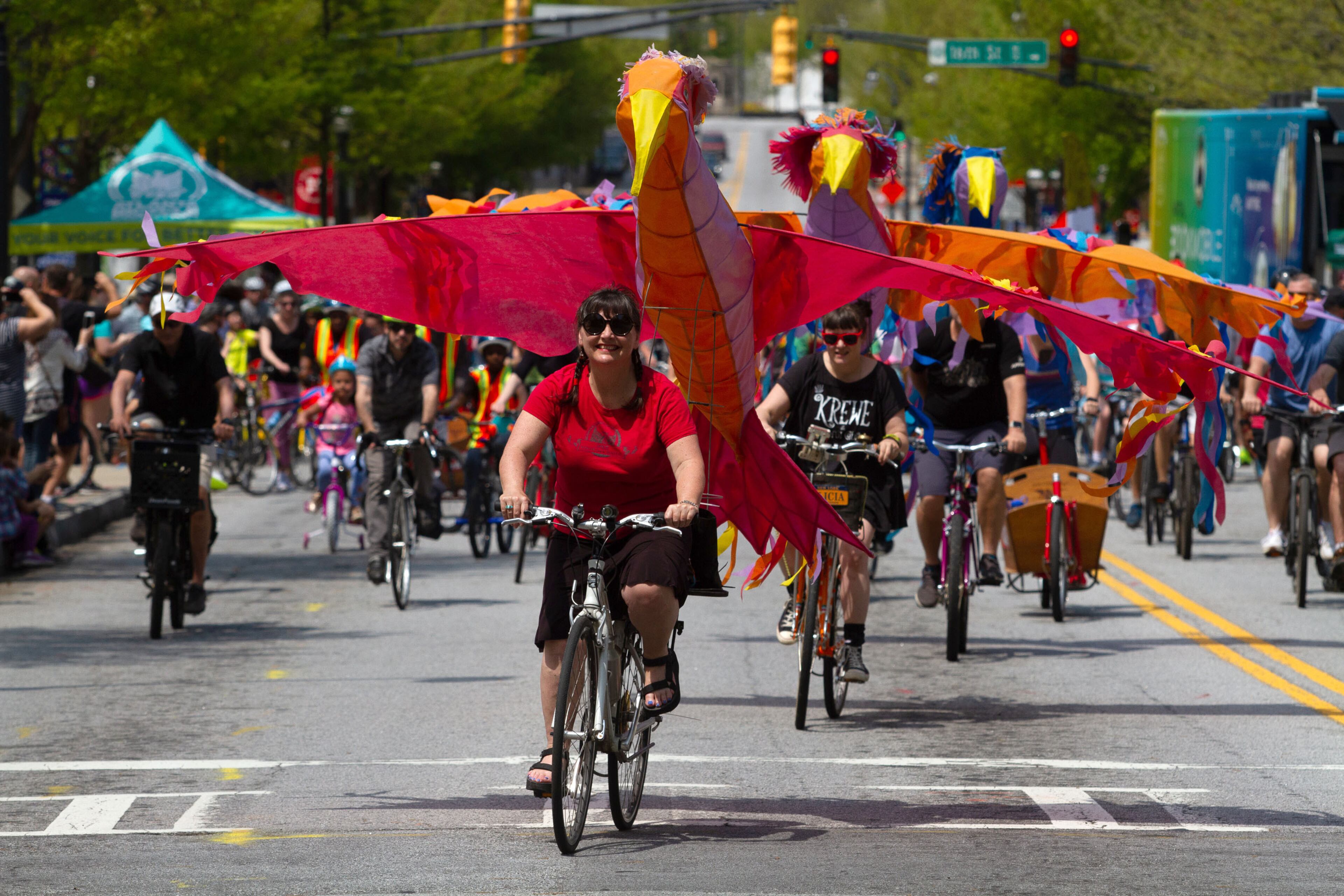 Chantelle Rytter and her red Phoenix lead the pack of bicycle riders at the start of the Atlanta Streets Alive ride Sunday, April 7, 2019. STEVE SCHAEFER / SPECIAL TO THE AJC
