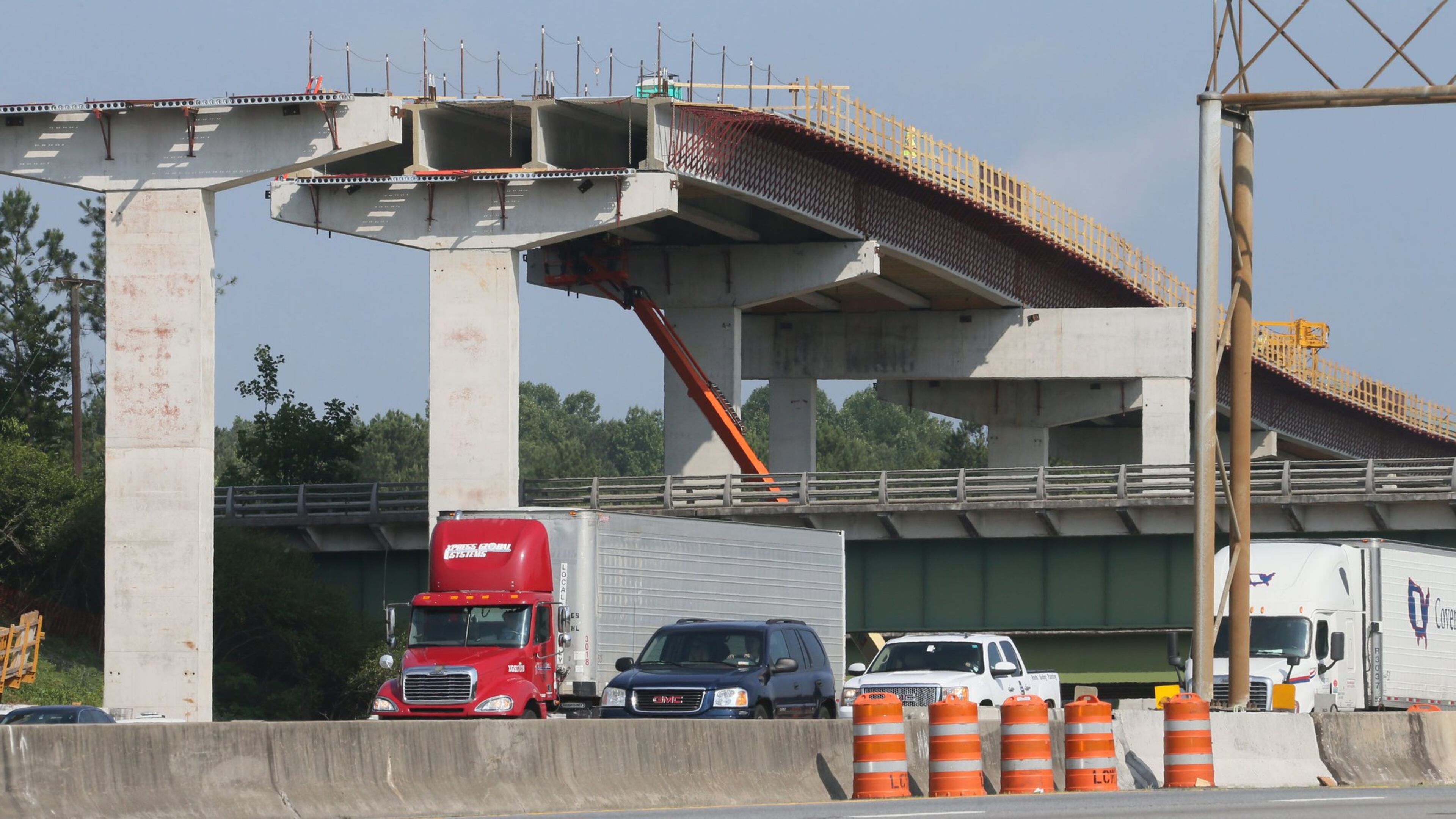 Construction is ongoing for the Northwest Corridor express lane project, which will add 29.7 miles of reversible toll lanes in the I-75/I-575 corridor. BOB ANDRES/BANDRES@AJC.COM
