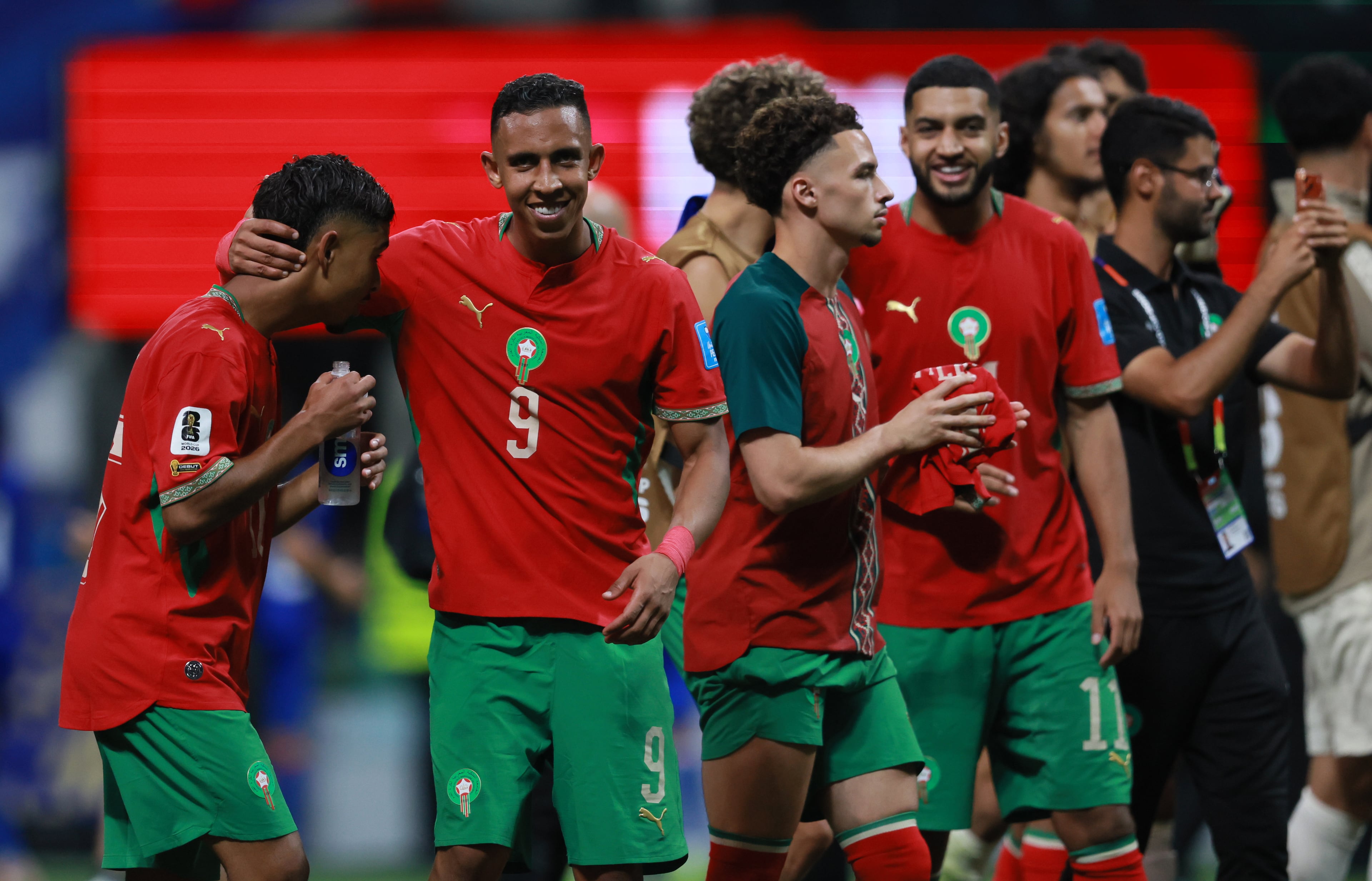 Morocco's Gessime Yassine, left and Morocco's Soufiane Rahimi (9), join teammates in celebrating their win against Haiti in Group C FIFA World Cup match at Atlanta Stadium (Mercedes-Benz Stadium) on Wednesday, June 24, 2026. (Jason Getz/AJC)