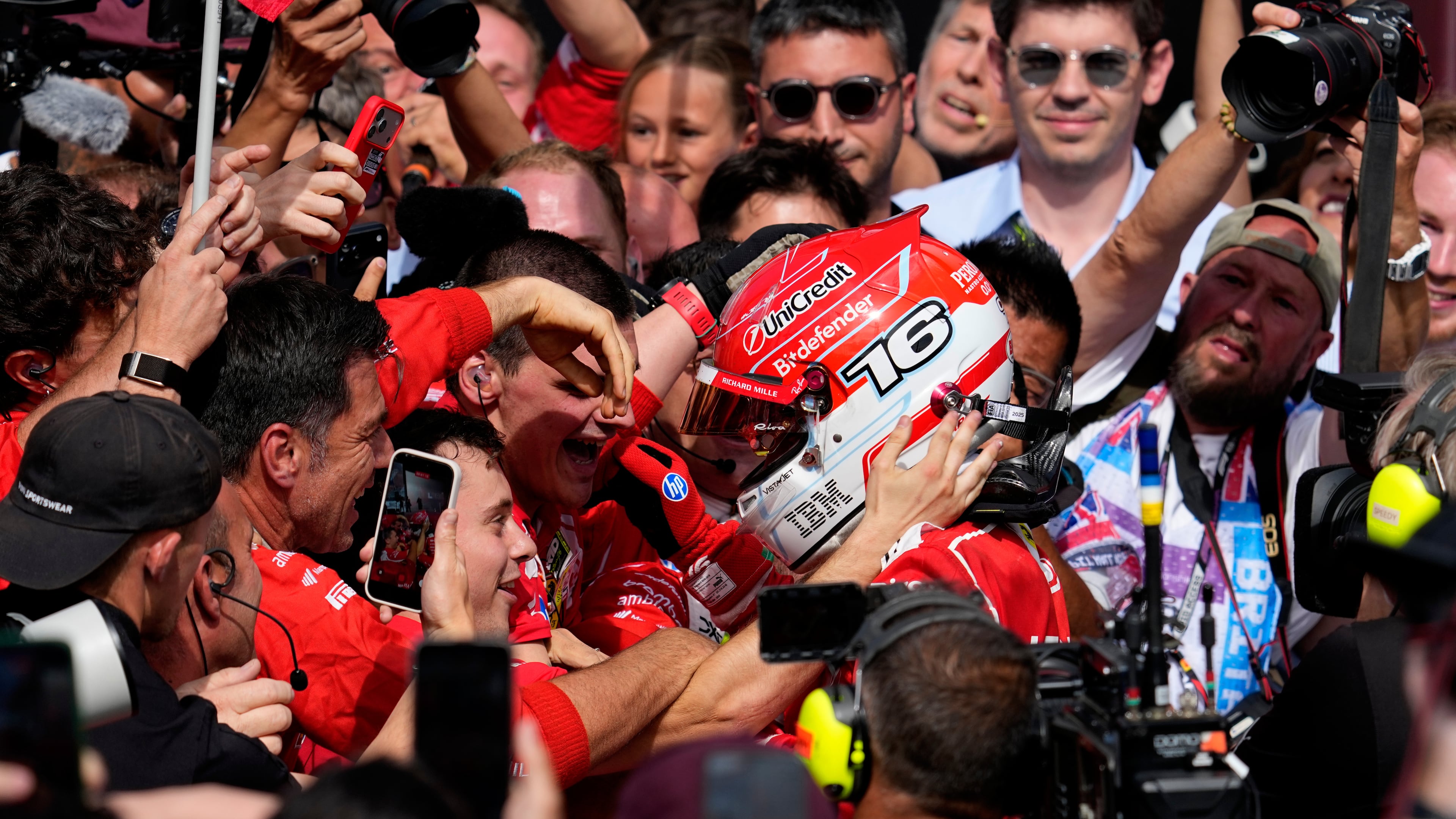 Ferrari driver Charles Leclerc of Monaco celebrates with his team after winning the British F1 Grand Prix, in Silverstone, England, Sunday, July 5, 2026. (AP Photo/Darko Bandic)