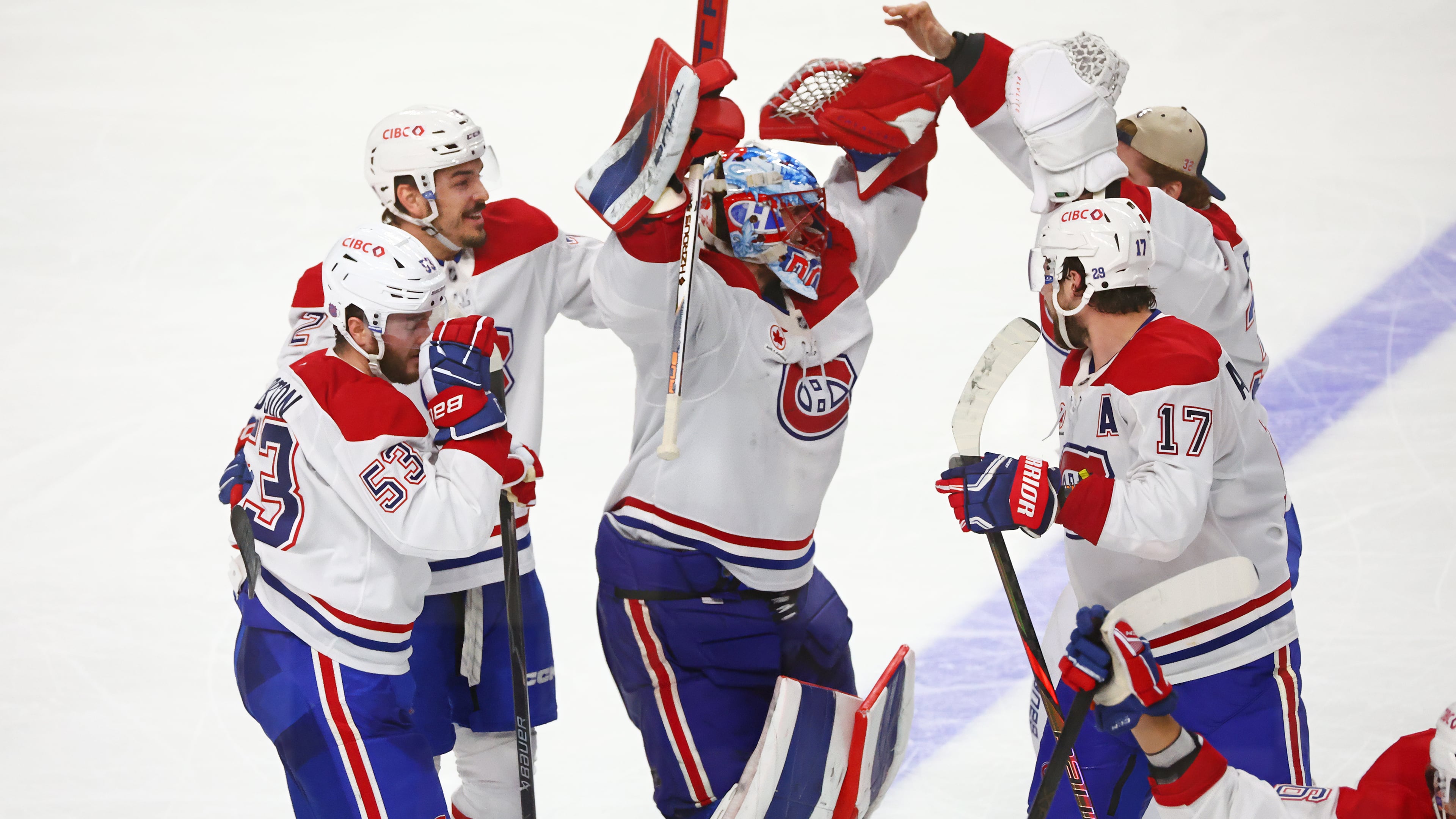 Montreal Canadiens players celebrate victory following the overtime period in Game 7 of a second-round NHL hockey Stanley Cup playoff series against the Buffalo Sabres, Monday, May 18, 2026, in Buffalo, N.Y. (AP Photo/Jeffrey T. Barnes)