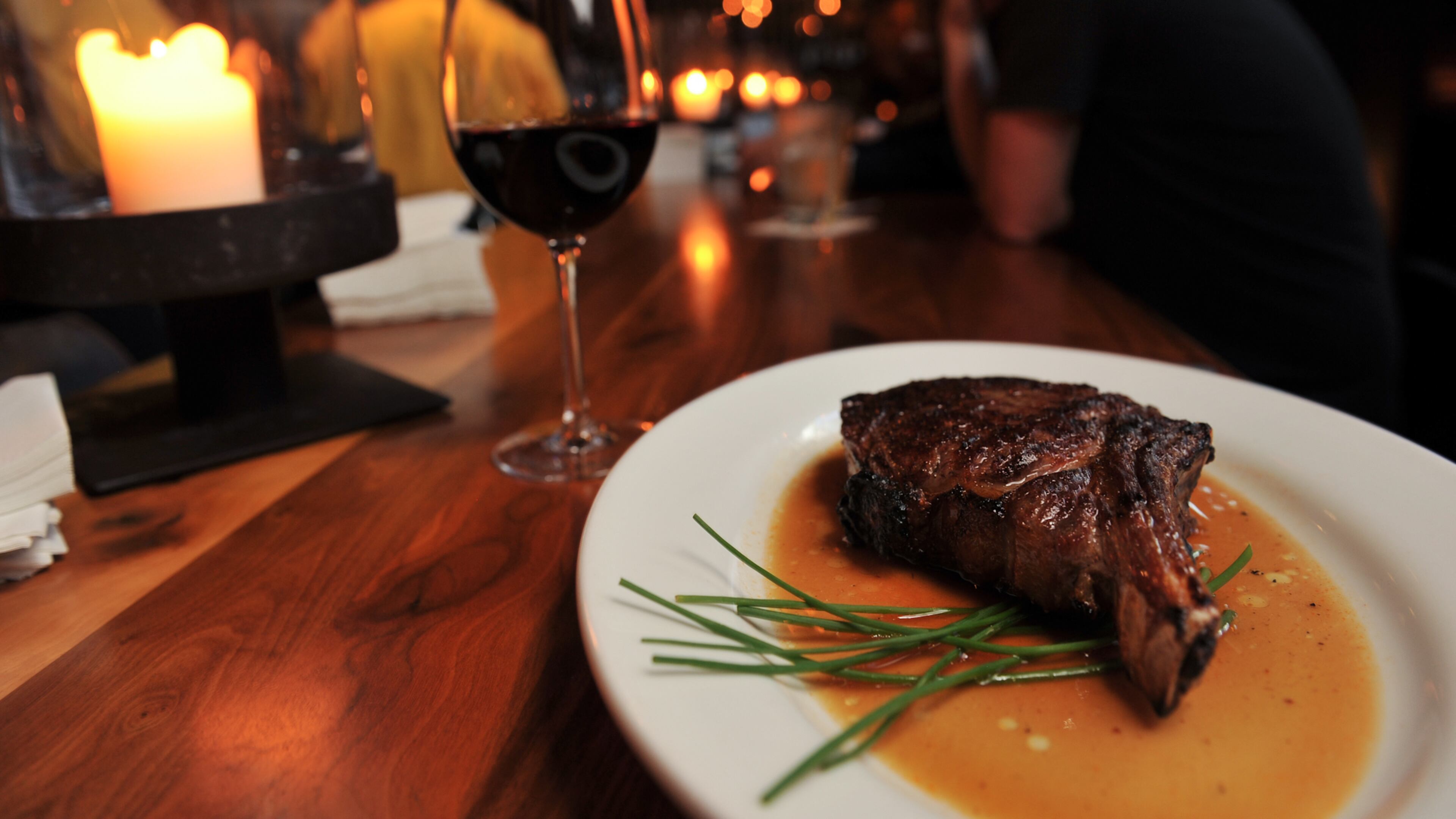 Ribeye and wine on the bar at Kevin Rathbun Steak. (Beckysteinphotography.com)