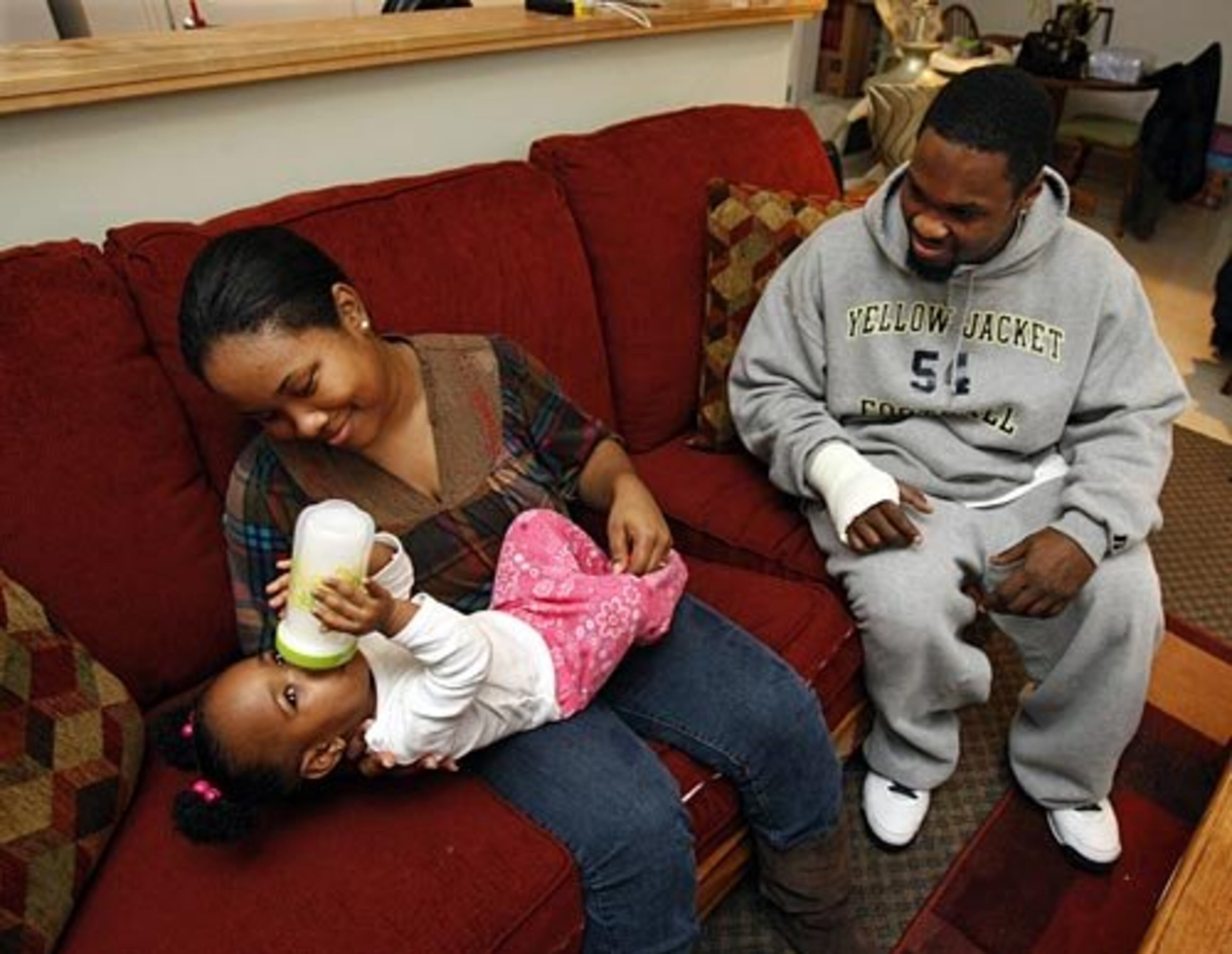 "I want to be a CPA; he wants football," Ashlyn (left) says. "We really want to reach our goals, so we never stop. After Jordyn came, there's no room for failure. We have to make it for her. We're not going to stop."