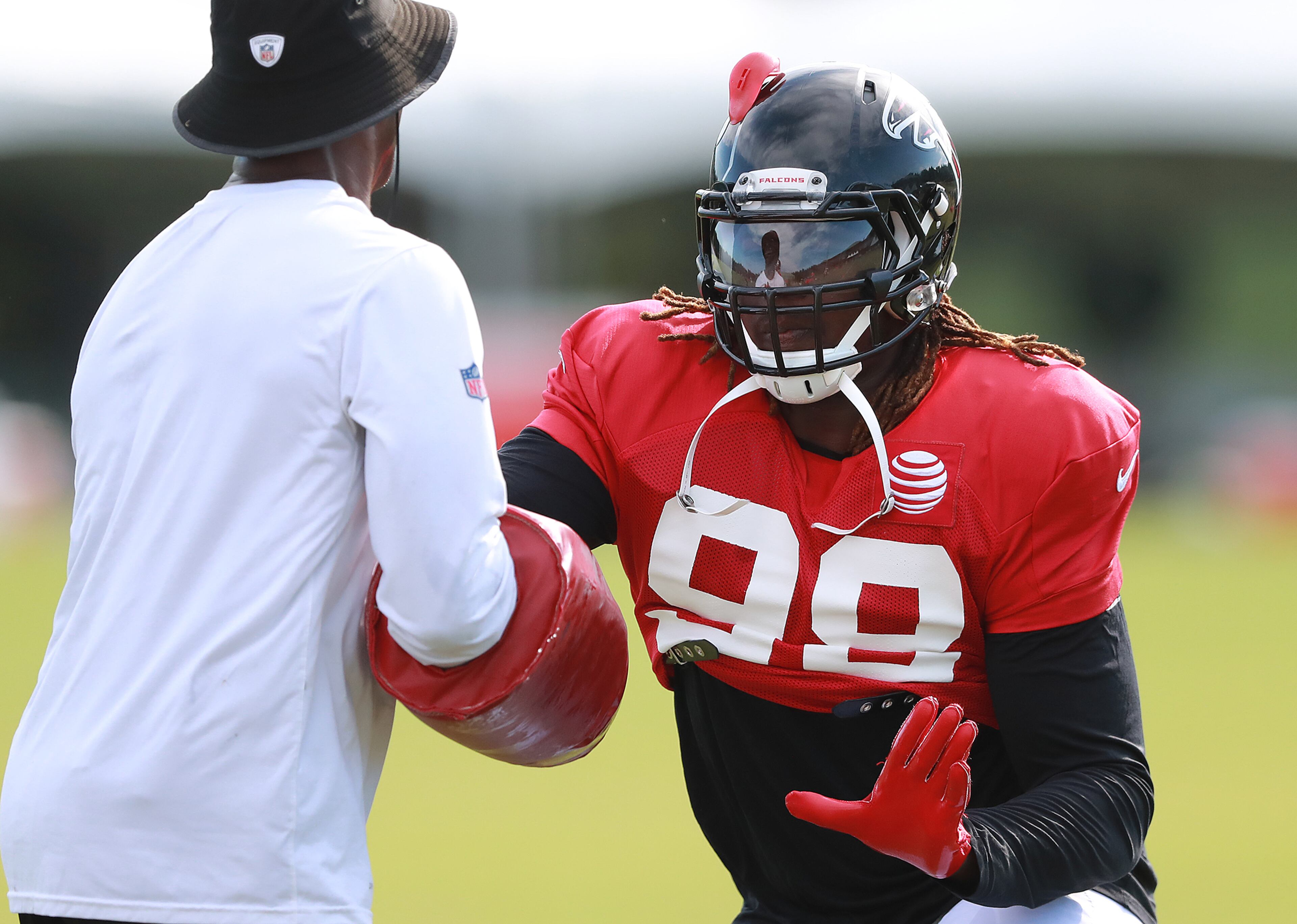 Falcons defensive end Takkarist McKinley runs a drill during a NFL football training camp practice on Tuesday, August 7, 2018, in Flowery Branch. Curtis Compton/ccompton@ajc.com