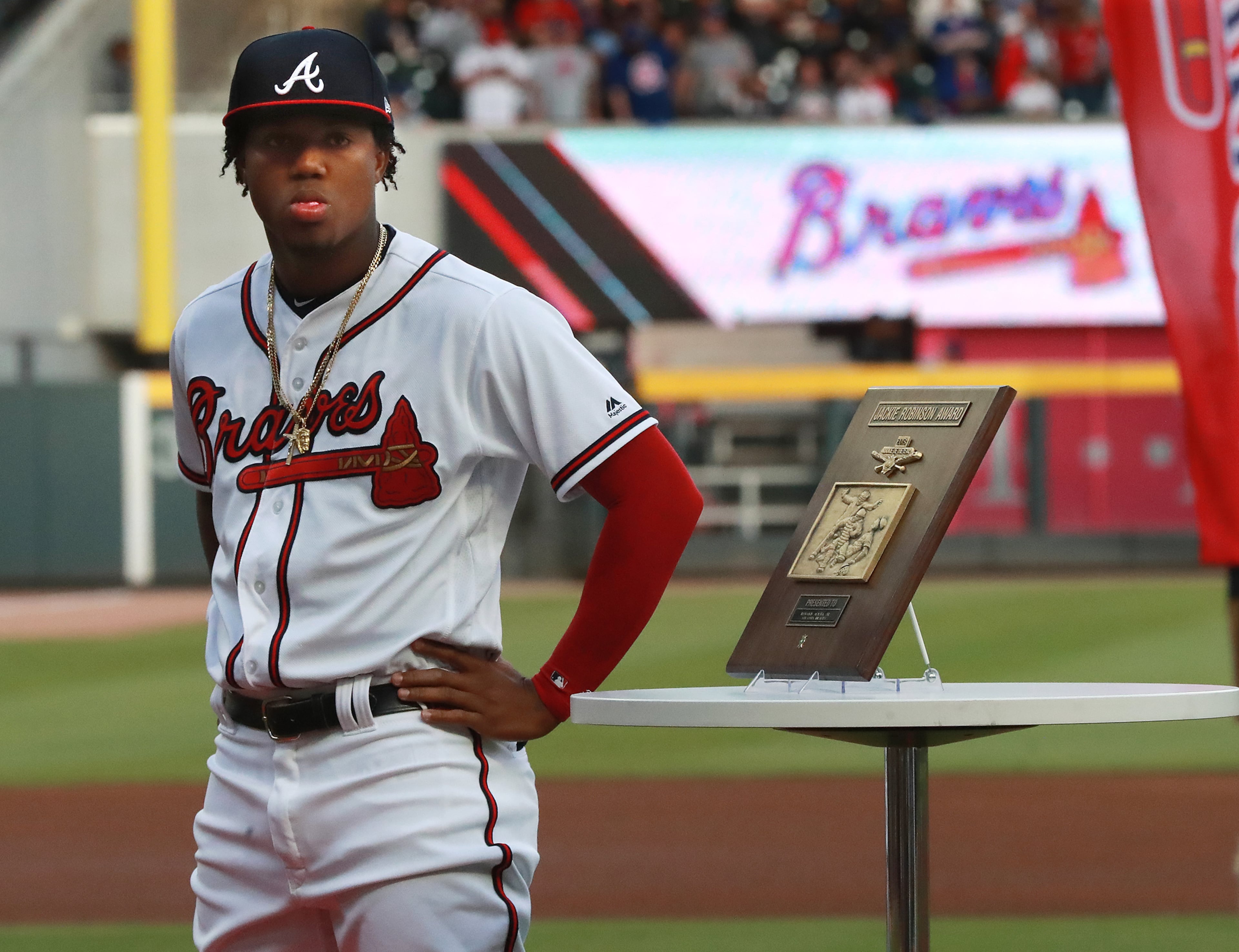 Braves outfielder Ronald Acuna Jr. receives the Rookie of the Year award before playing the Chicago Cubs. Curtis Compton/ccompton@ajc.com