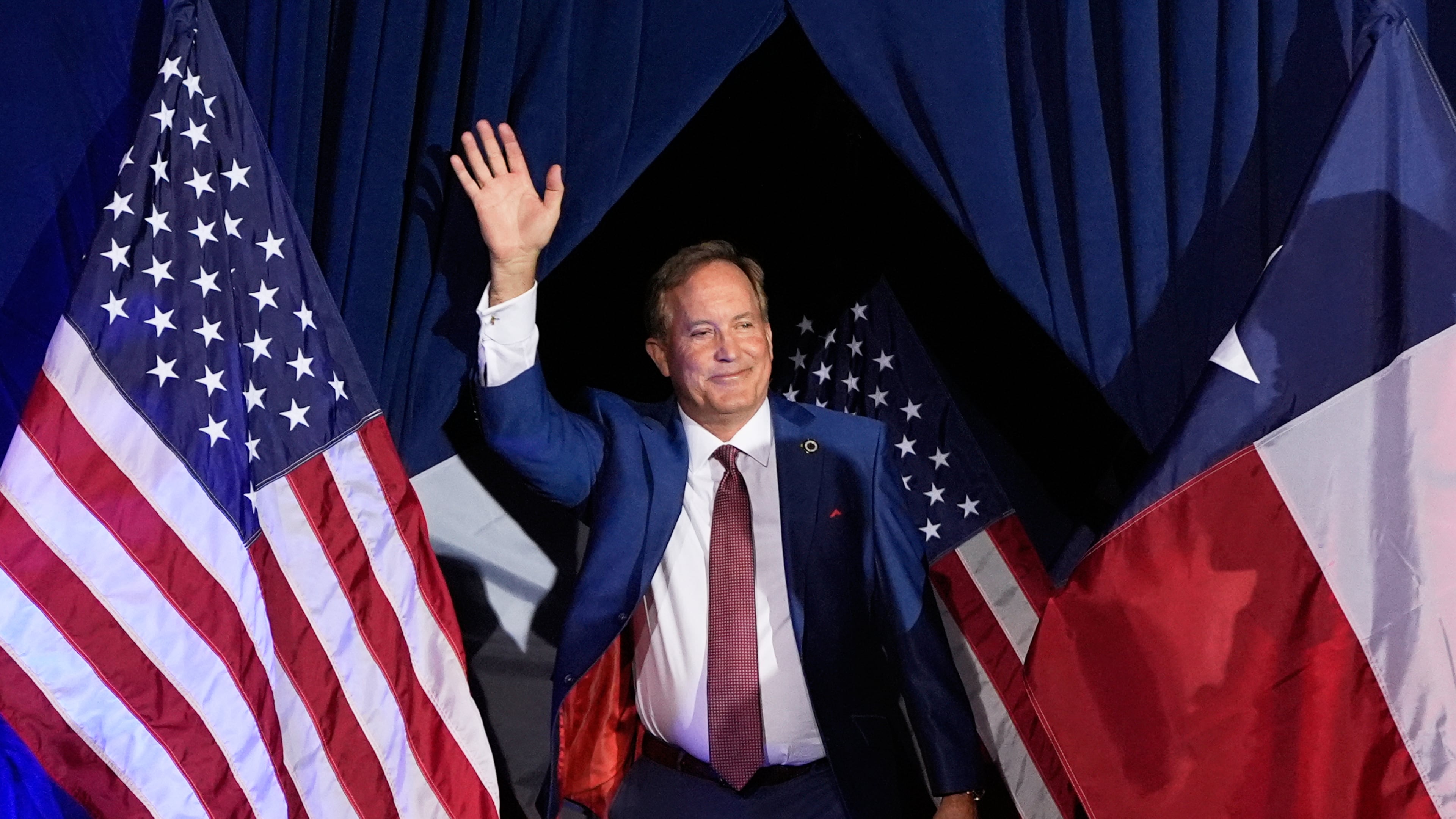 Texas Attorney General Ken Paxton, a Republican candidate for the U.S. Senate, waves as he takes the stage during a primary runoff election night event after winning the Republican party's nomination Tuesday, May 26, 2026, in Plano, Texas. (AP Photo/Tony Gutierrez)