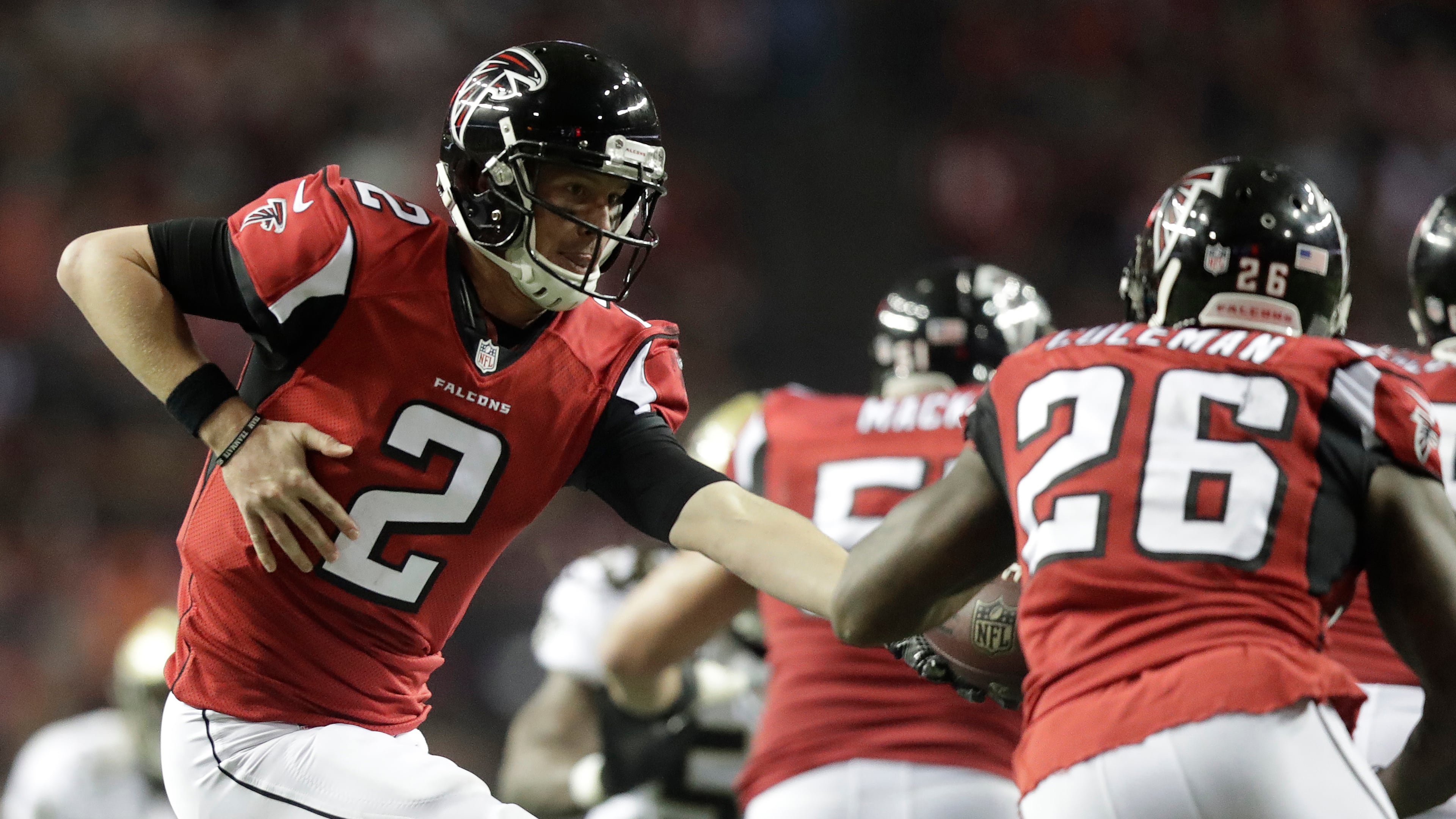 Atlanta Falcons quarterback Matt Ryan (2) hands the ball to running back Tevin Coleman (26) during the regular season finale against the New Orleans Saints Sunday, Jan. 1, 2017, at the Georgia Dome in Atlanta.