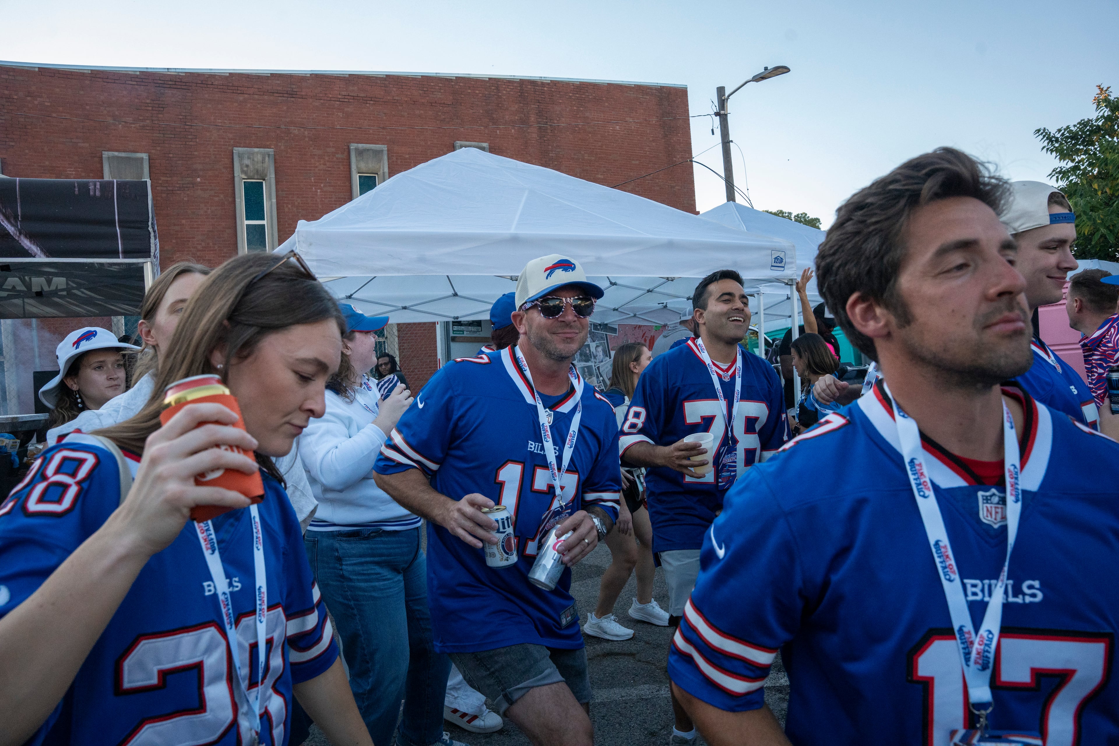 Buffalo Bills fans dance and celebrate at a tailgate near Mercedes-Benz Stadium on Monday, Oct. 13, 2025, in Atlanta, before the Monday Night Football game between the Bills and the Falcons. (Olivia Bowdoin for the AJC)