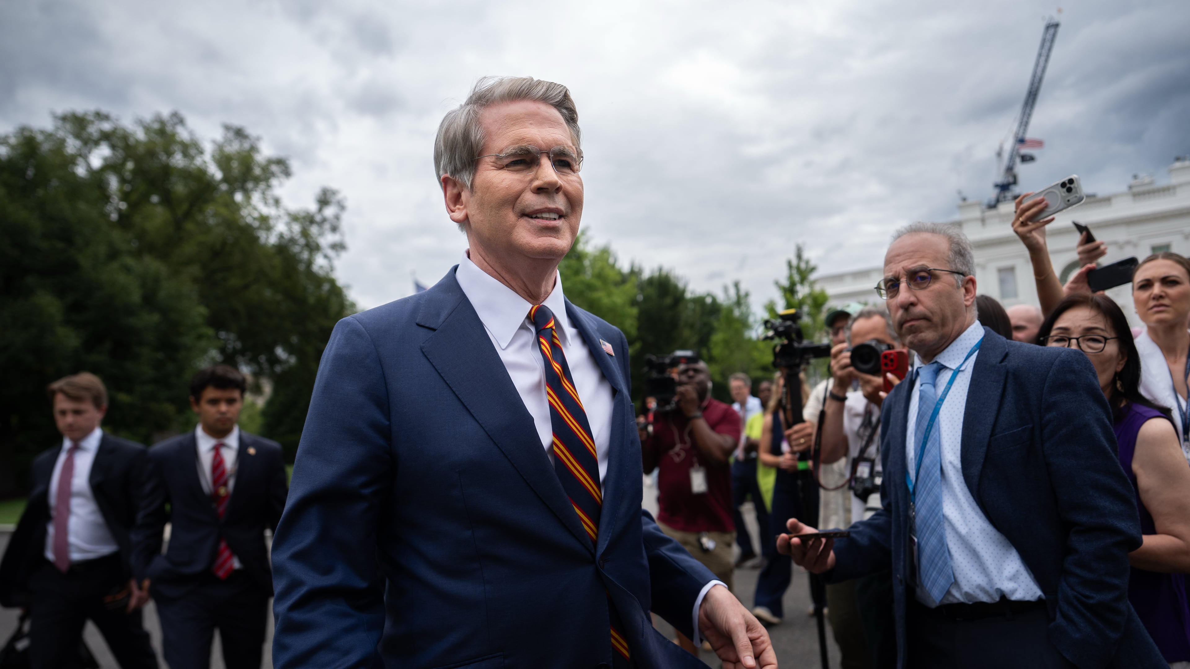 Treasury Secretary Scott Bessent walks past reporters following an interview with Fox News outside the White House, Thursday, July 30, 2026, in Washington. (AP Photo/Julia Demaree Nikhinson)