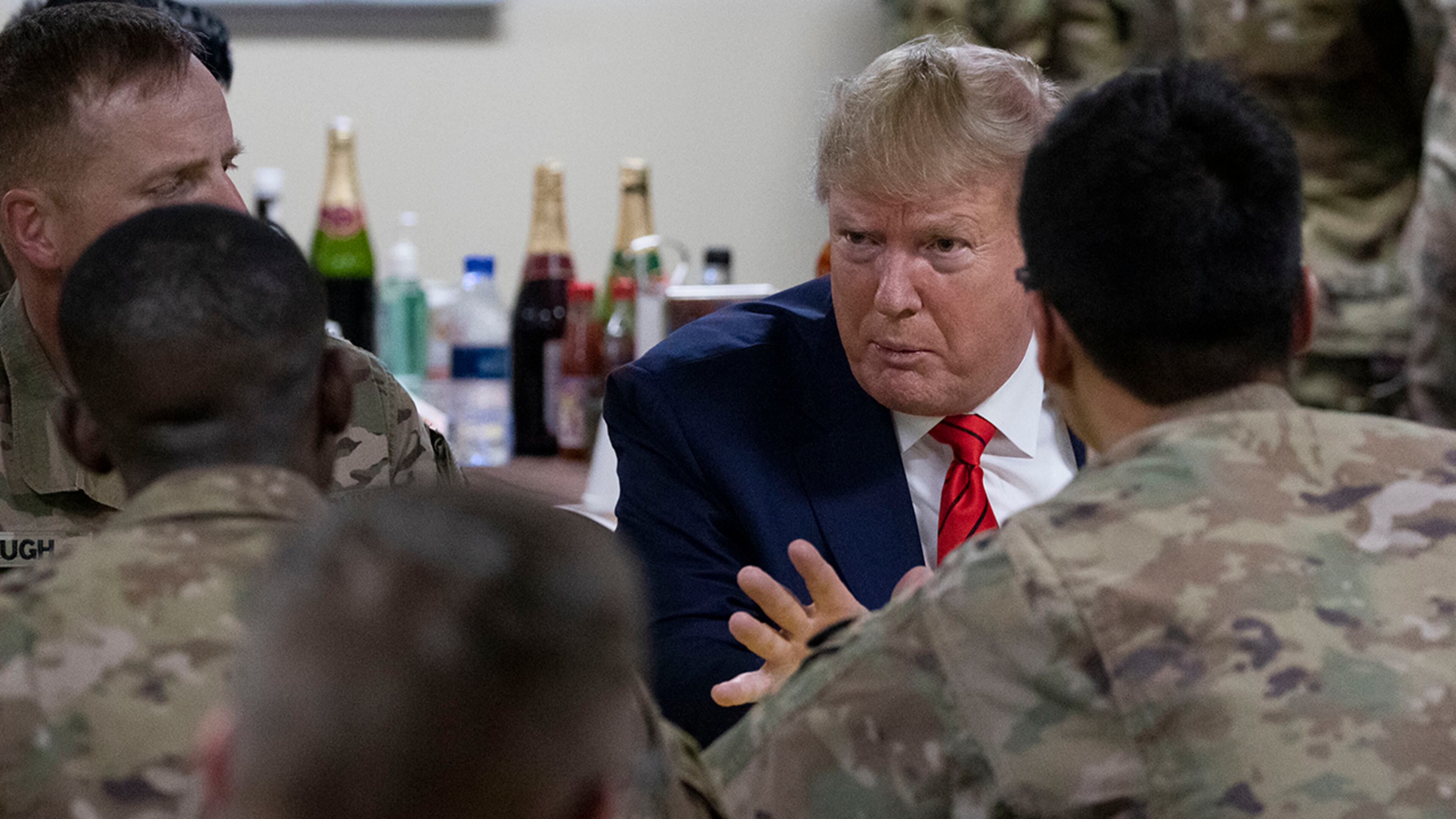 President Donald Trump speaking to members of the military in a dining facility during a surprise Thanksgiving Day visit, Thursday, Nov. 28, 2019, at Bagram Air Field, Afghanistan. (AP Photo/Alex Brandon)