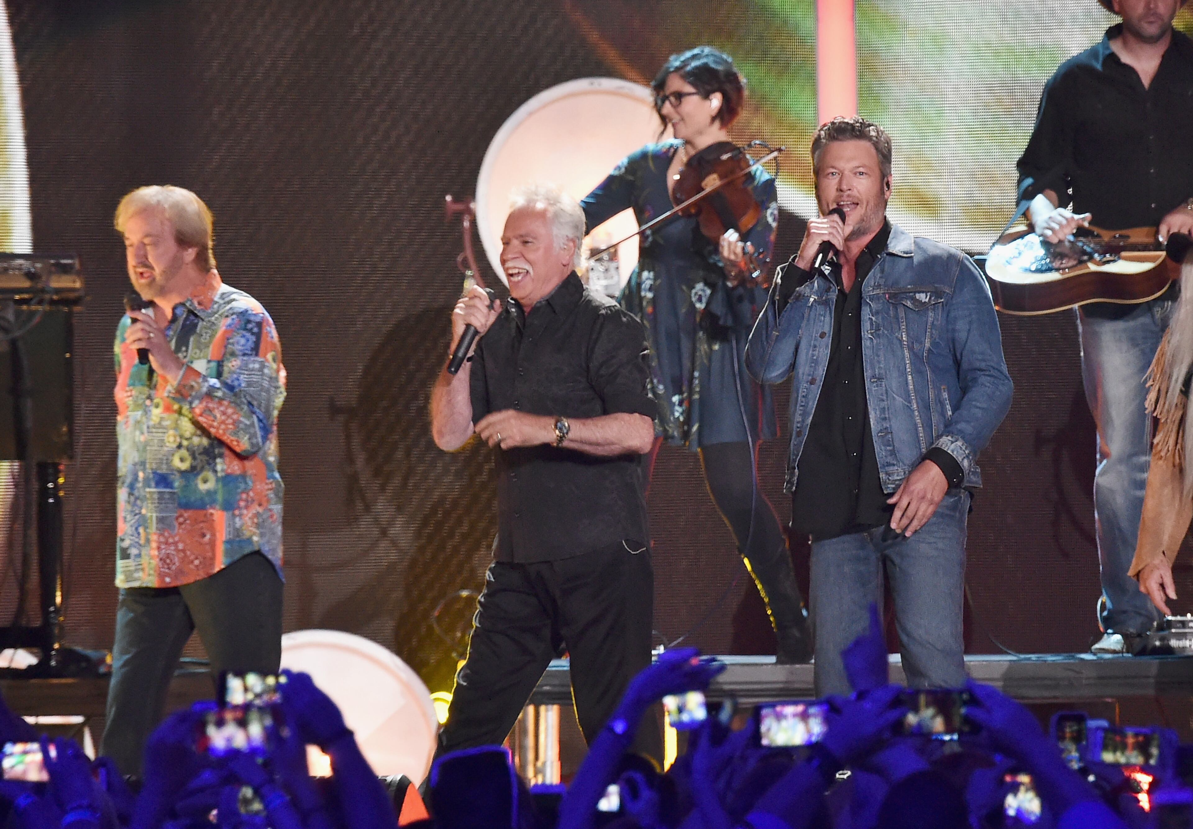 NASHVILLE, TN - JUNE 08: William Lee Golden, Richard Sterban, Joe Bonsall, Duane Allen from musical group The Oak Ridge Boys and singer-songwriter Blake Shelton performs onstage during the 2016 CMT Music awards at the Bridgestone Arena on June 8, 2016 in Nashville, Tennessee. (Photo by Mike Coppola/Getty Images for CMT)