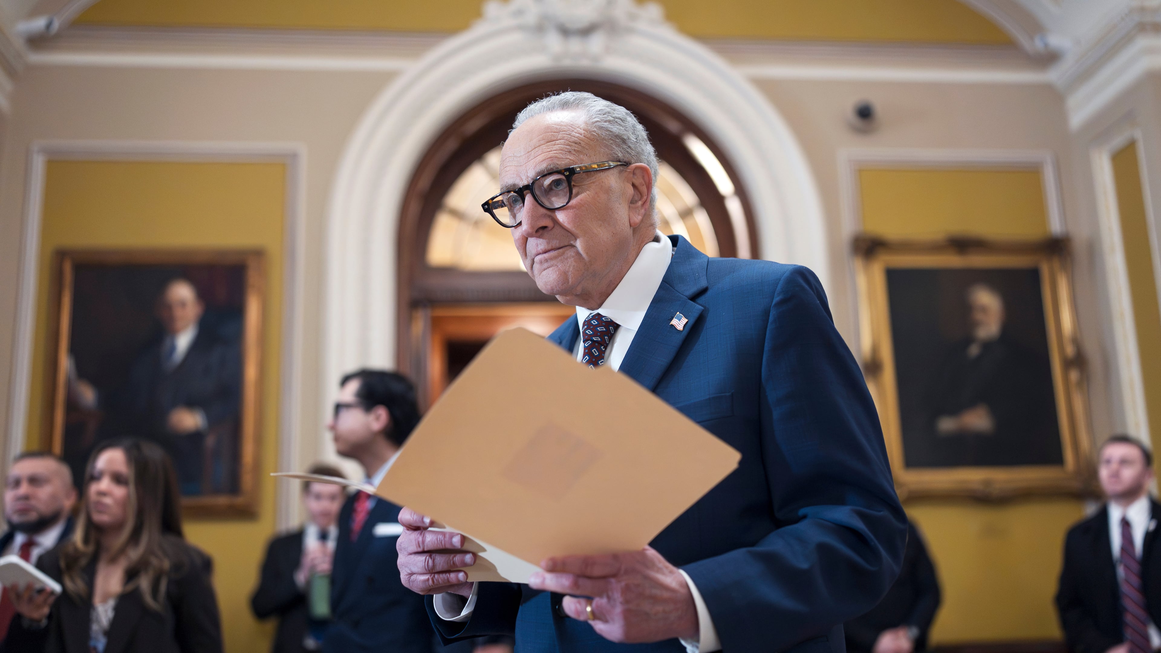 FILE—Senate Minority Leader Chuck Schumer, D-N.Y., waits to speak to reporters following a closed-door meeting with fellow Democrats on spending legislation that funds the Department of Homeland Security and a swath of other government agencies as the country reels from the deaths of two people at the hands of federal agents in Minneapolis, at the Capitol in Washington, Wednesday, Jan. 28, 2026. (AP Photo/J. Scott Applewhite, File)