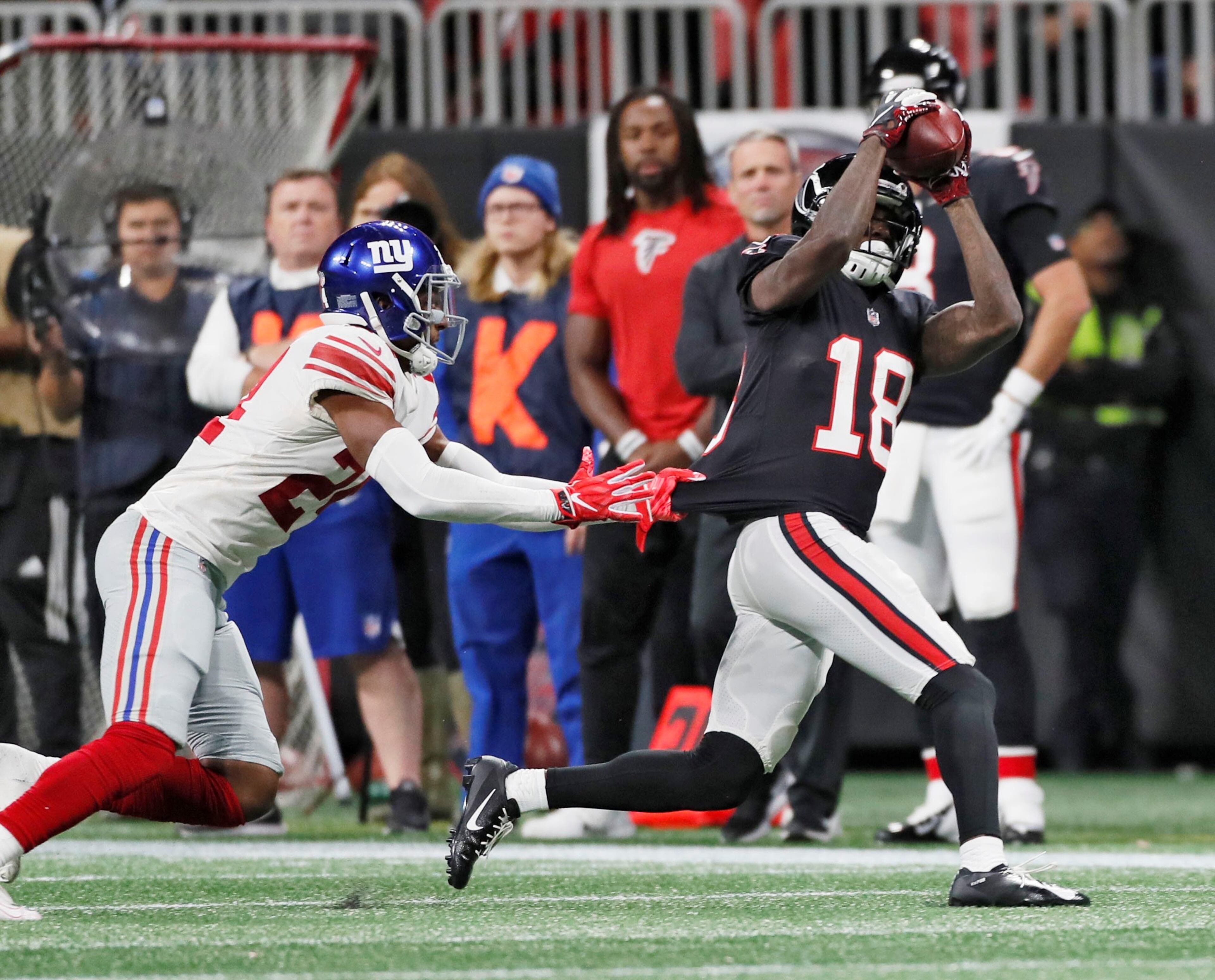 10/22/18 - Atlanta - Atlanta Falcons wide receiver Calvin Ridley (18) makes this 1st down catch on the Falcons final scoring drive which ended with a field goal by Atlanta Falcons kicker Giorgio Tavecchio (4). The Atlanta Falcons played the New York Giants in an NFL football game Monday, October 22, 2018, at Mercedes-Benz Stadium in Atlanta, GA. BOB ANDRES / BANDRES@AJC.COM