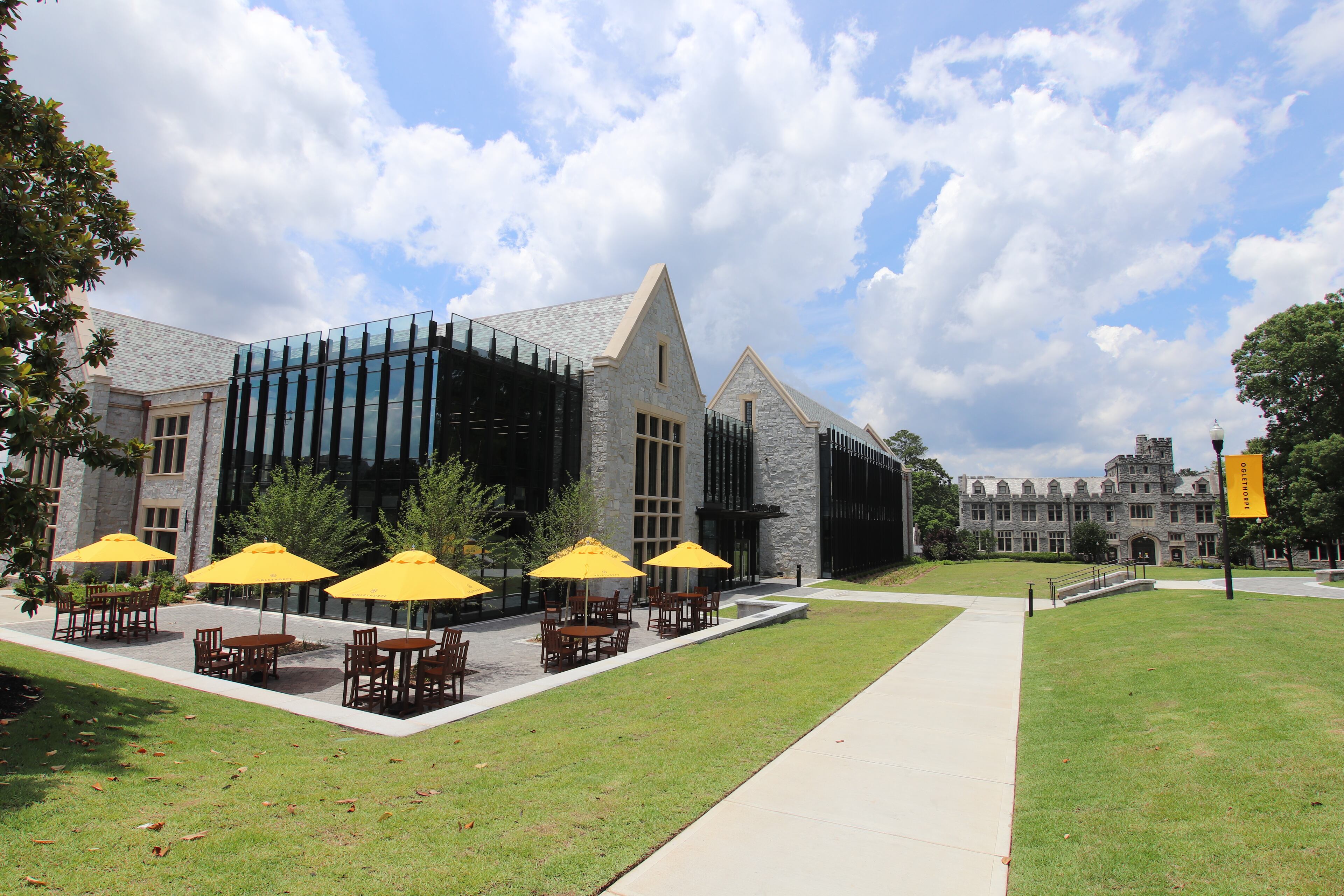 This is Oglethorpe University's Cousins Center, which is officially open. The 45,000 square foot glass and granite, state-of-the-art building features separate labs for biology, chemistry, physics, and ecology, as well as learning spaces for the Hammack School of Business in collaboration with Porsche Cars, N.A. and Global Payments.