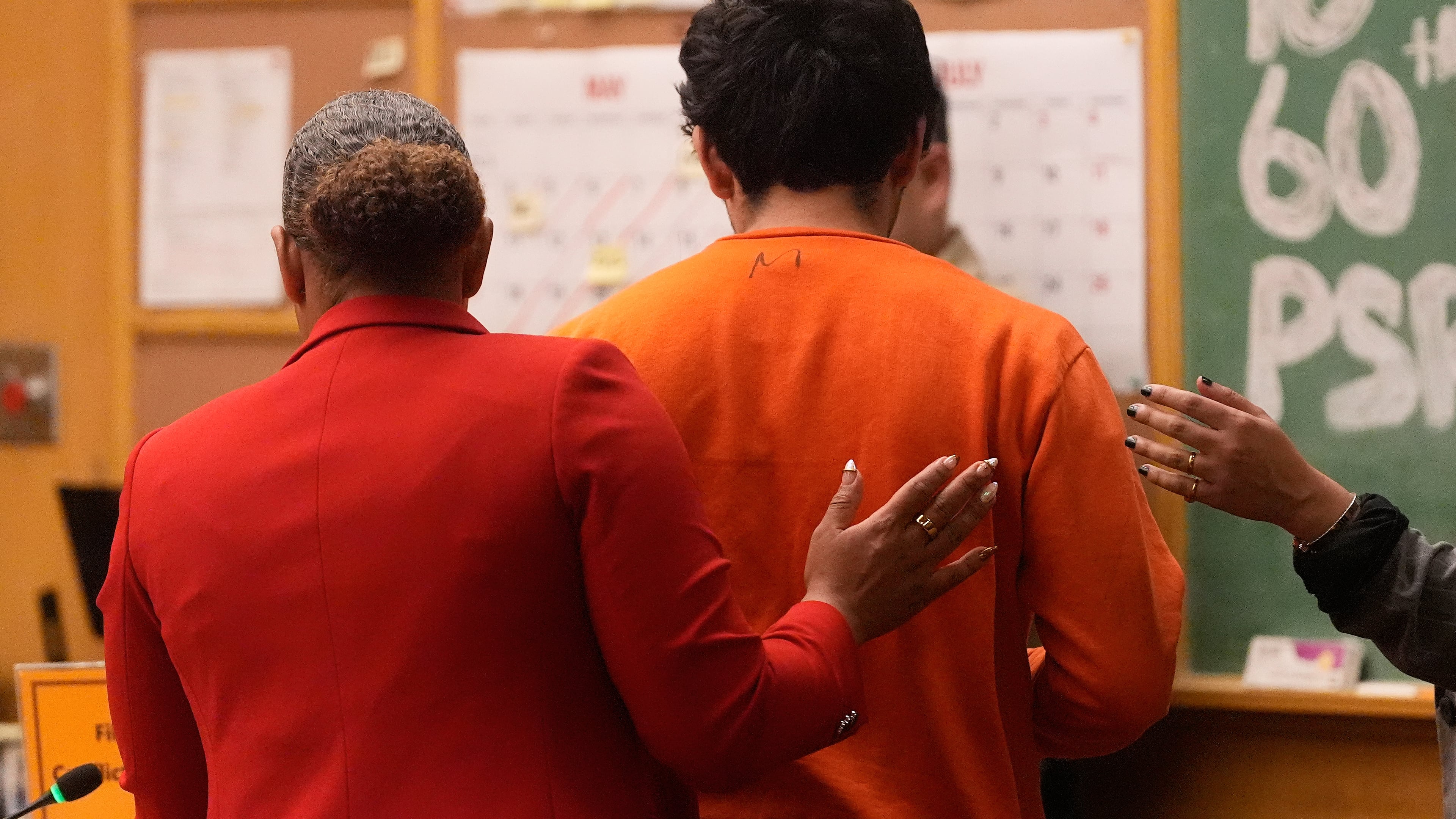 Daniel Moreno-Gama, right, leaves court with public defender Diamond Ward on Tuesday, April 14, 2026, in San Francisco. (AP Photo/Jeff Chiu, Pool)