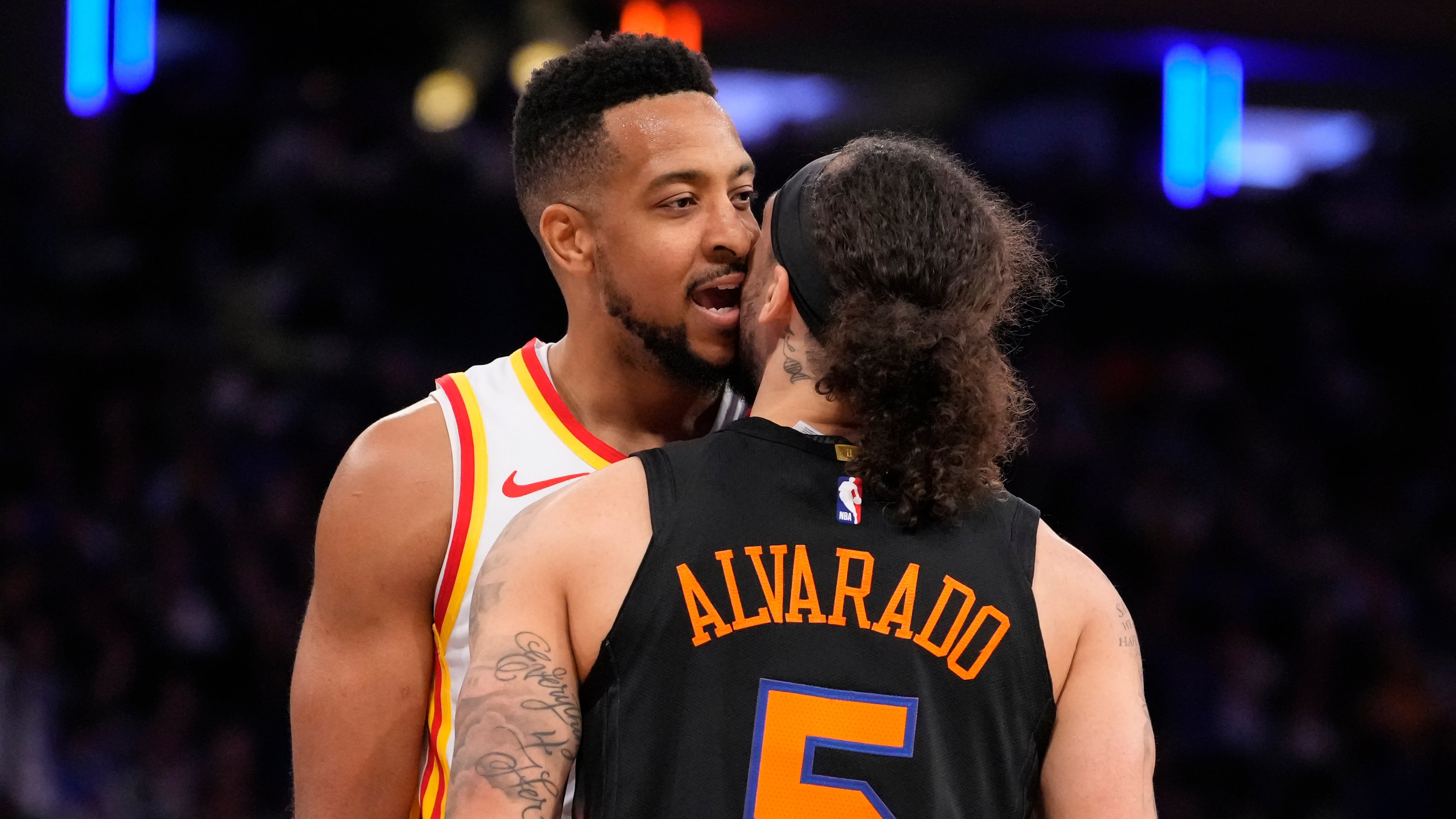 Atlanta Hawks guard CJ McCollum, left, argues with New York Knicks guard Jose Alvarado (5) during the second half in Game 2 of a first-round NBA playoffs basketball series, Monday, April 20, 2026, in New York. (AP Photo/Yuki Iwamura)