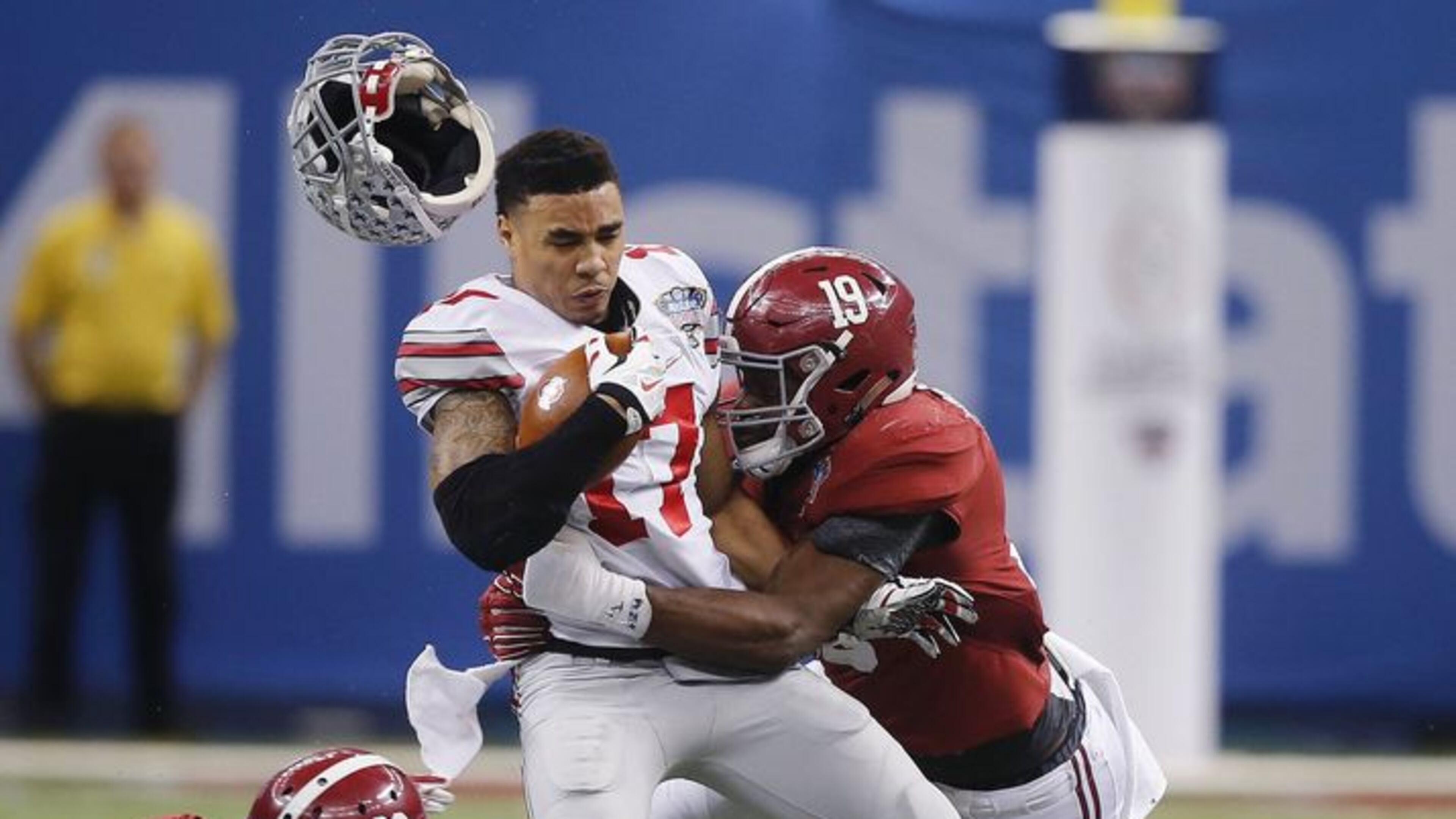 Ohio State running back Jalin Marshall (17) is hit by Alabama linebacker Reggie Ragland (19) as Alabama defensive back Landon Collins (26) looks on in the Sugar Bowl, a playoff semifinal game Jan. 1, 2015. (AP Photo/Bill Haber)