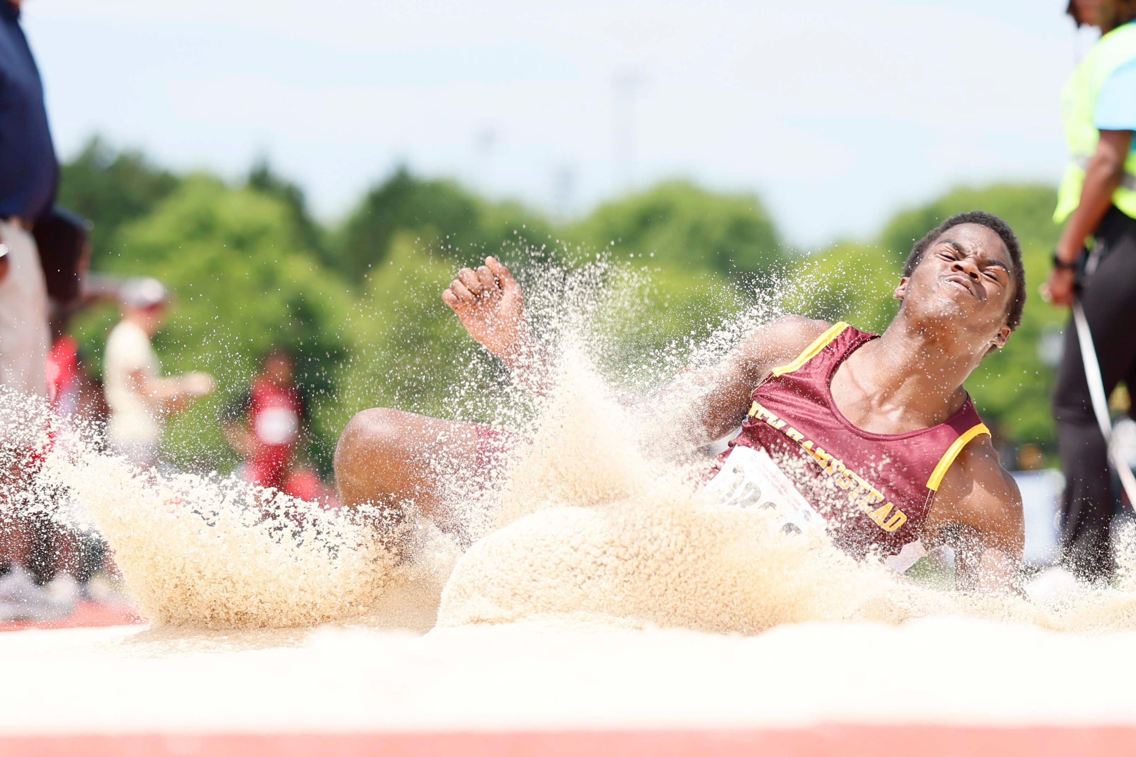 New Hampstead High School’s Ari Theriot reacts after landing in a long jump during the Boys AAAA Long Jump at the GHSA track and field state championships held at UGA’s Spec Towns Track on Monday, May 11, 2026, in Athens. (Miguel Martinez/AJC)