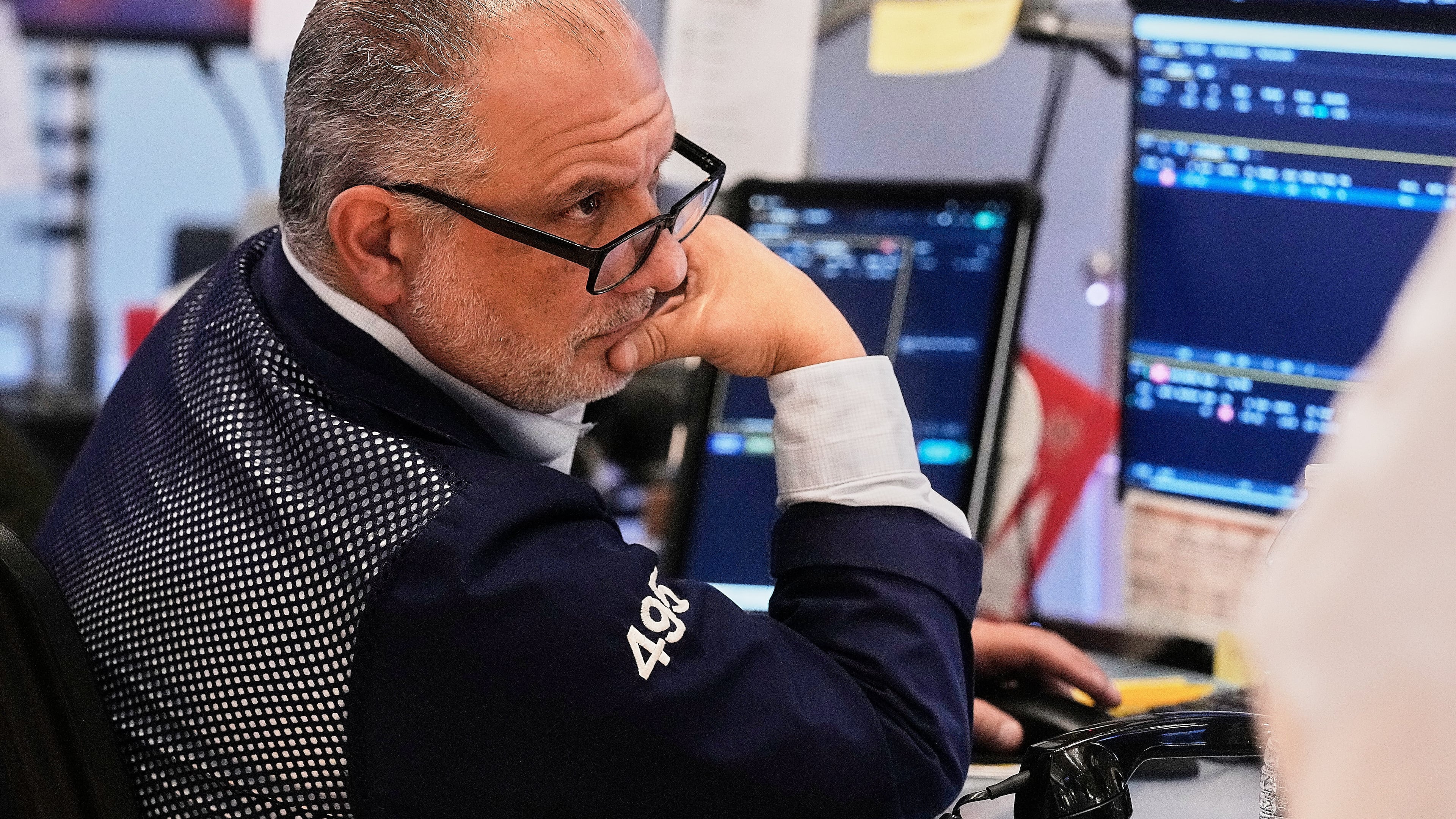 FILE - Trader Joel Lucchese works on the floor of the New York Stock Exchange, Wednesday, Jan. 7, 2026. (AP Photo/Richard Drew, file)