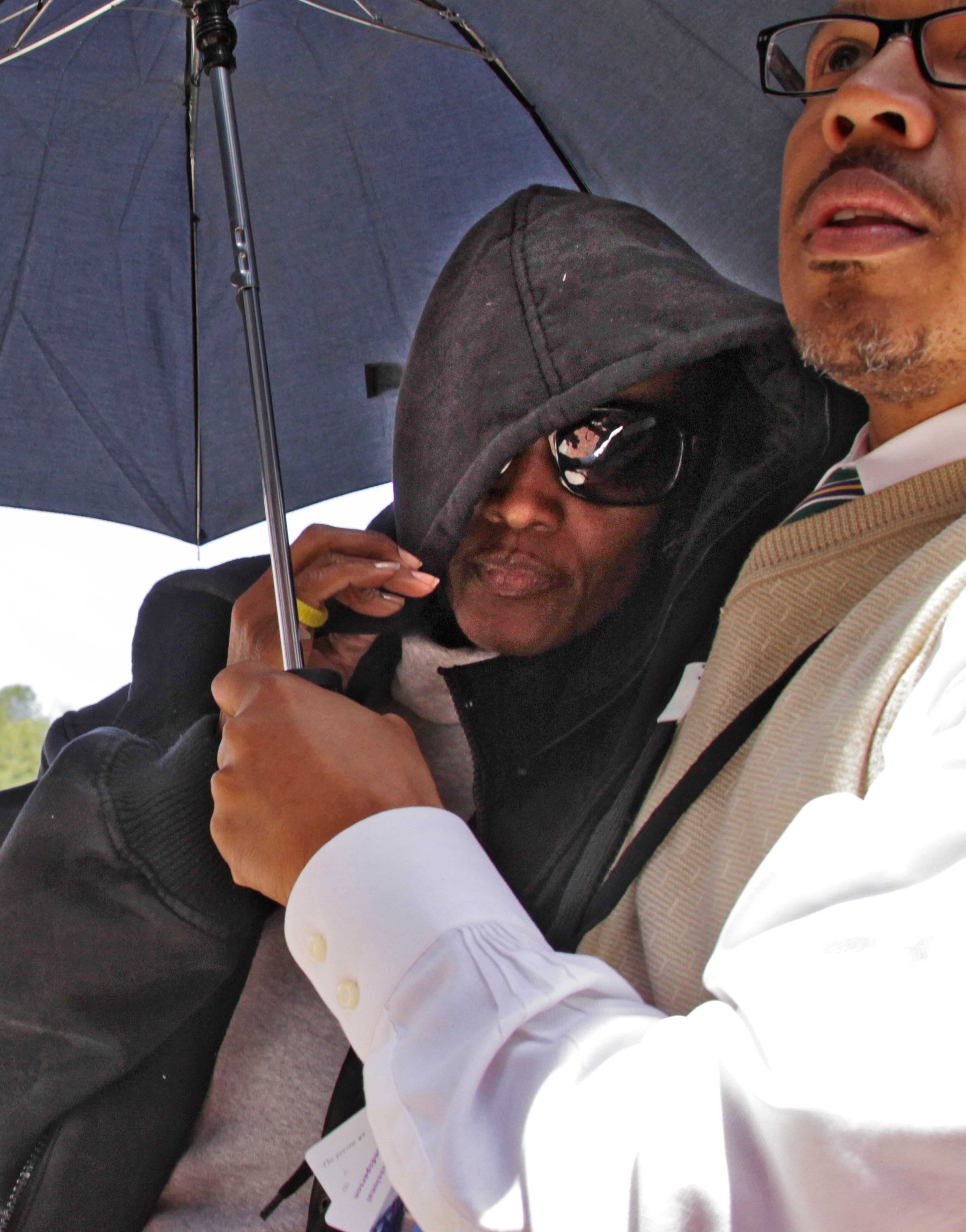 The second of two unidentified persons to turn themselves in this afternoon shielded their identity.