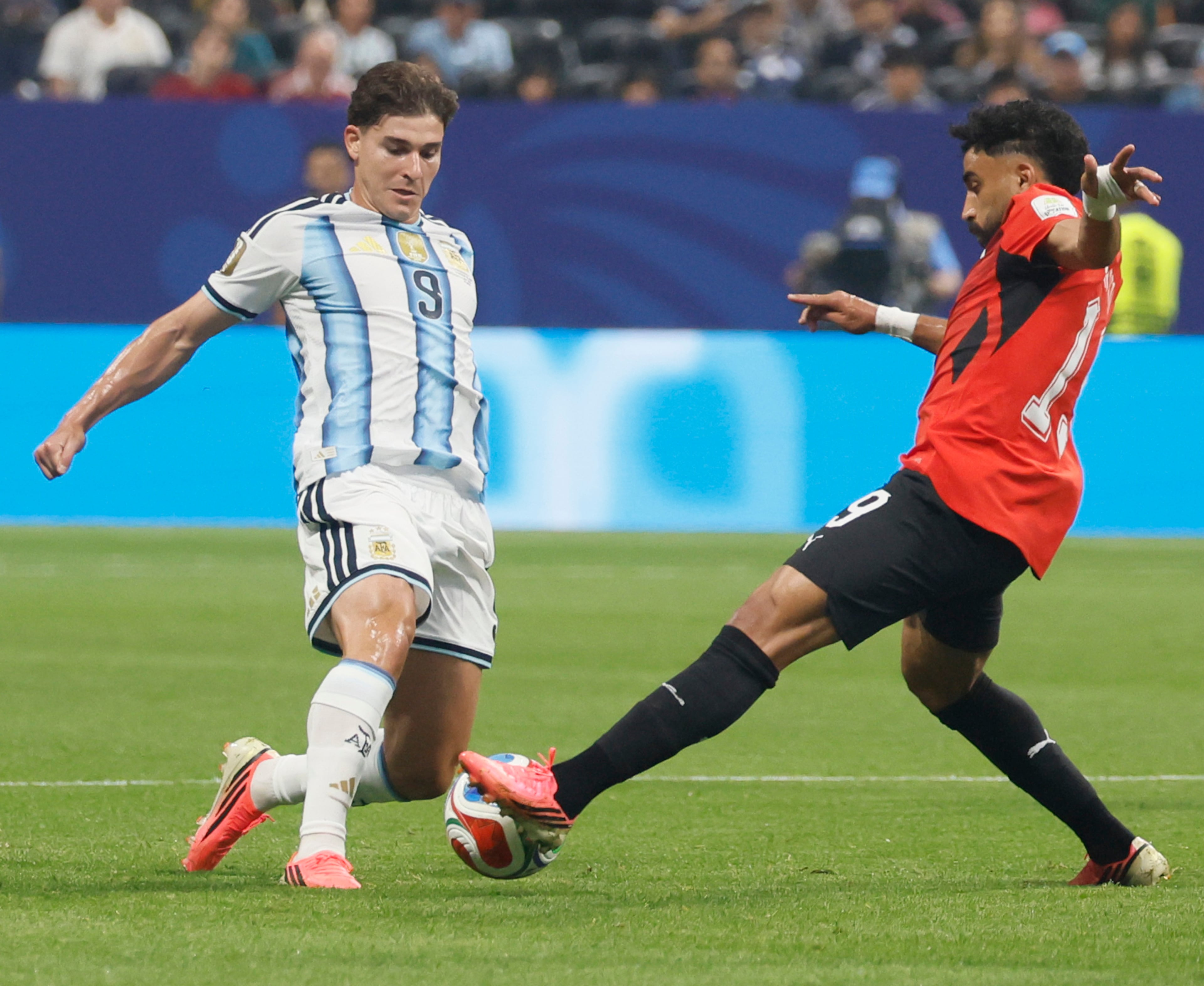 Argentina's Julian Alvarez, left, battles Egypt's Mohanad Lashin for ball during first half of Argentina vs. Egypt FIFA World Cup match at Atlanta Stadium (Mercedes-Benz Stadium) on Tuesday, July 7, 2026. (Miguel Martinez/AJC)