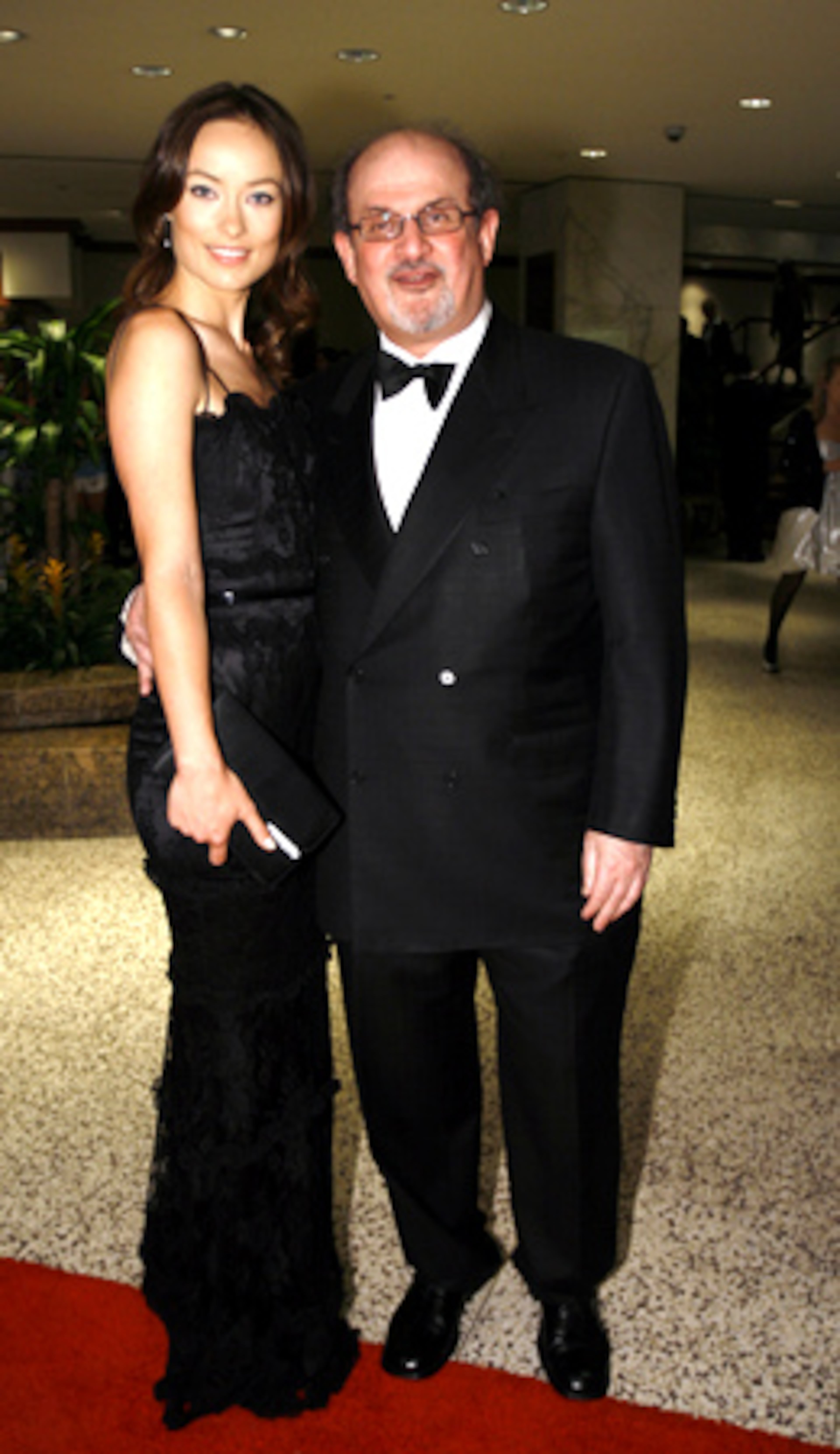 ... AS WAS HER ex-husband SALMAN RUSHDIE (right), who was making schmoopy with (married, to someone else) actress OLIVIA WILDE.