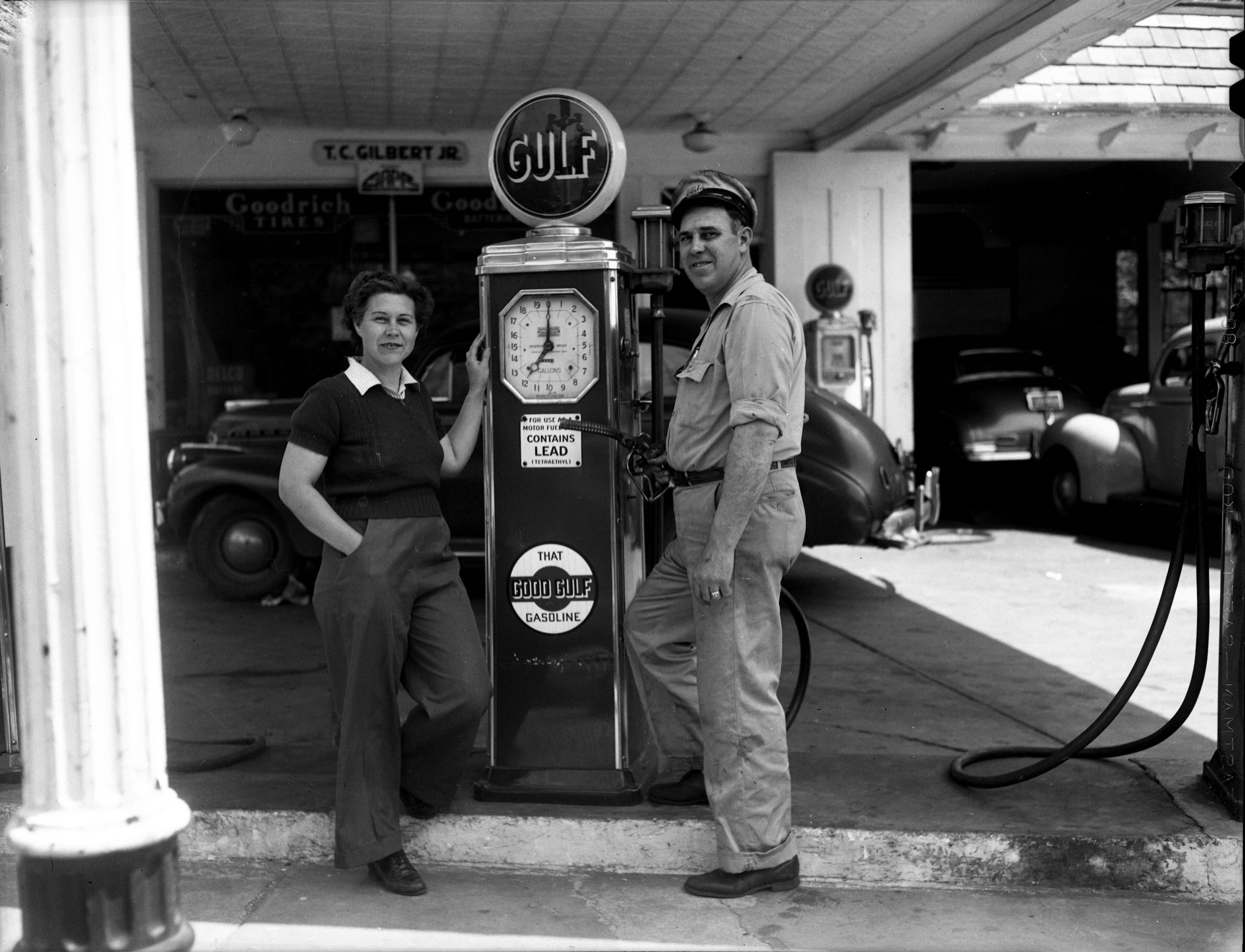 A man and a woman standing by a gasoline pump at T.C. Gilbert Jr.'s Gulf Station in Atlanta in 1943. LBT02-112a, Lane Brothers Commercial Photographers Photographic Collection, 1920-1976. Photographic Collection, Special Collections and Archives, Georgia State University Library.
