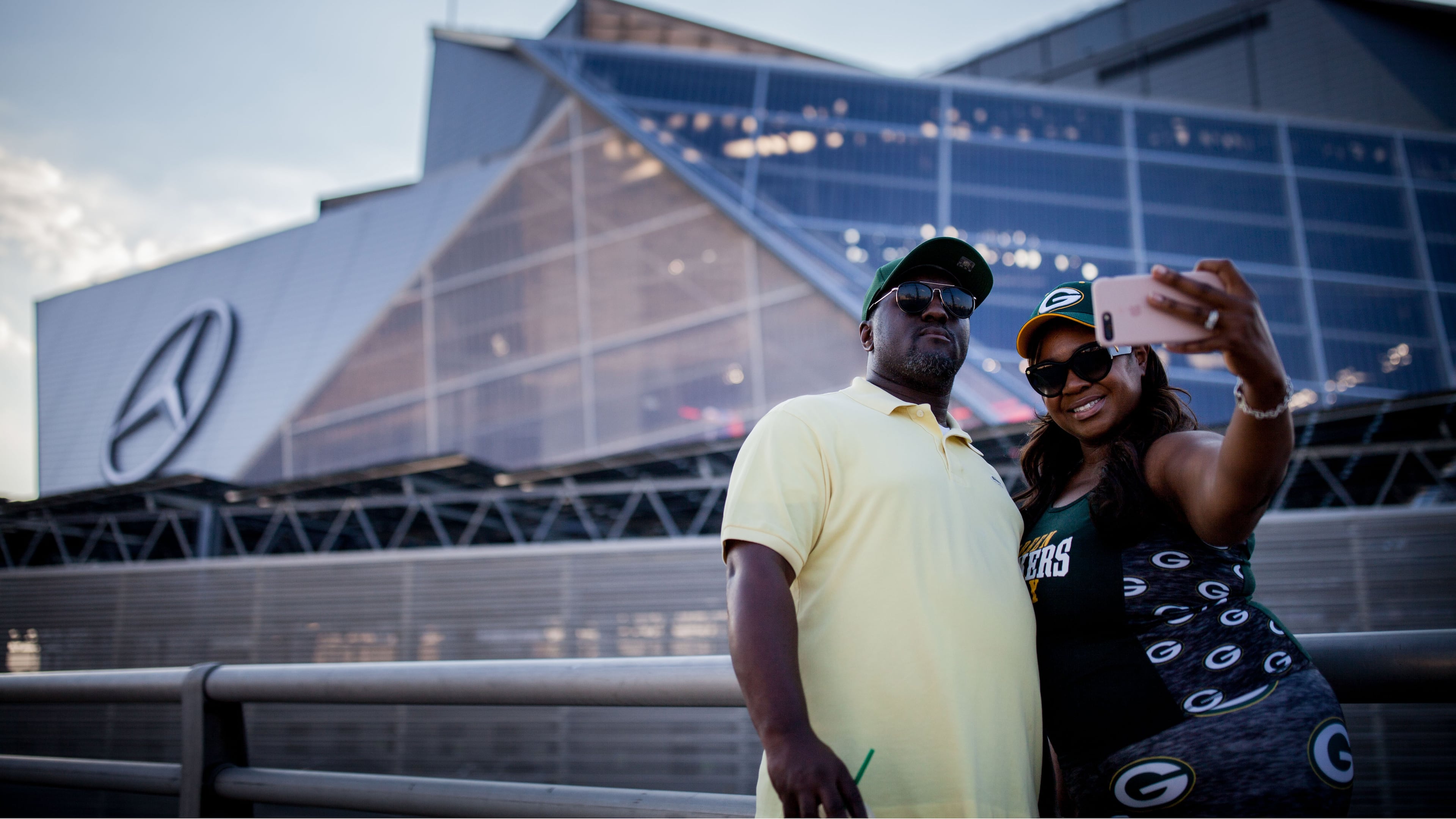Green Bay Packers fans Fred Jones, left, and Sherrea Jones take a selfie in front of the Mercedes-Benz Stadium before an NFL football game between the Atlanta Falcons and Green Bay Packers, Sunday, Sept. 17, 2017, in Atlanta. BRANDEN CAMP/SPECIAL