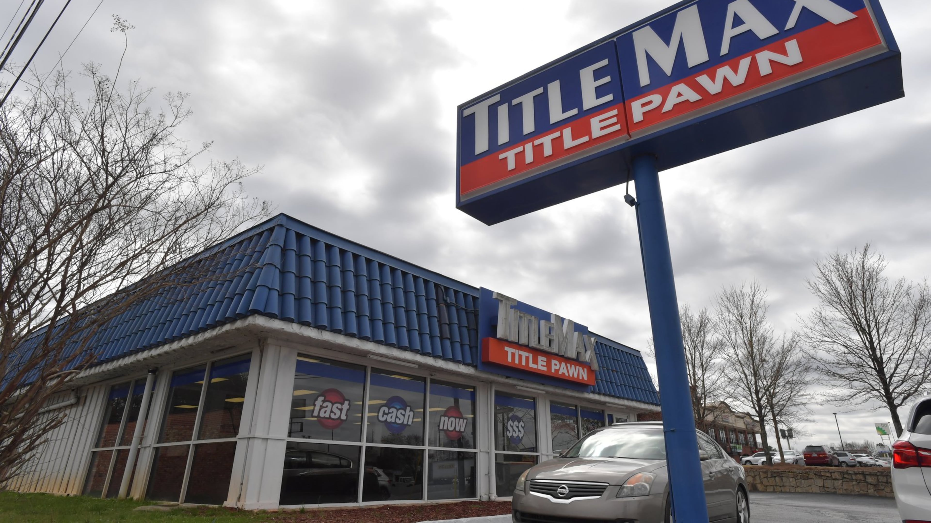 The Consumer Financial Protection Bureau wants to scrap a rule that would have required payday loan and vehicle title companies, such as this TitleMax in Doraville, to assess whether consumers can afford loans. The rule, which was to take effect later this year, was intended to protect consumers trapped in a cycle of loans with exorbitant interest rates. HYOSUB SHIN / HSHIN@AJC.COM