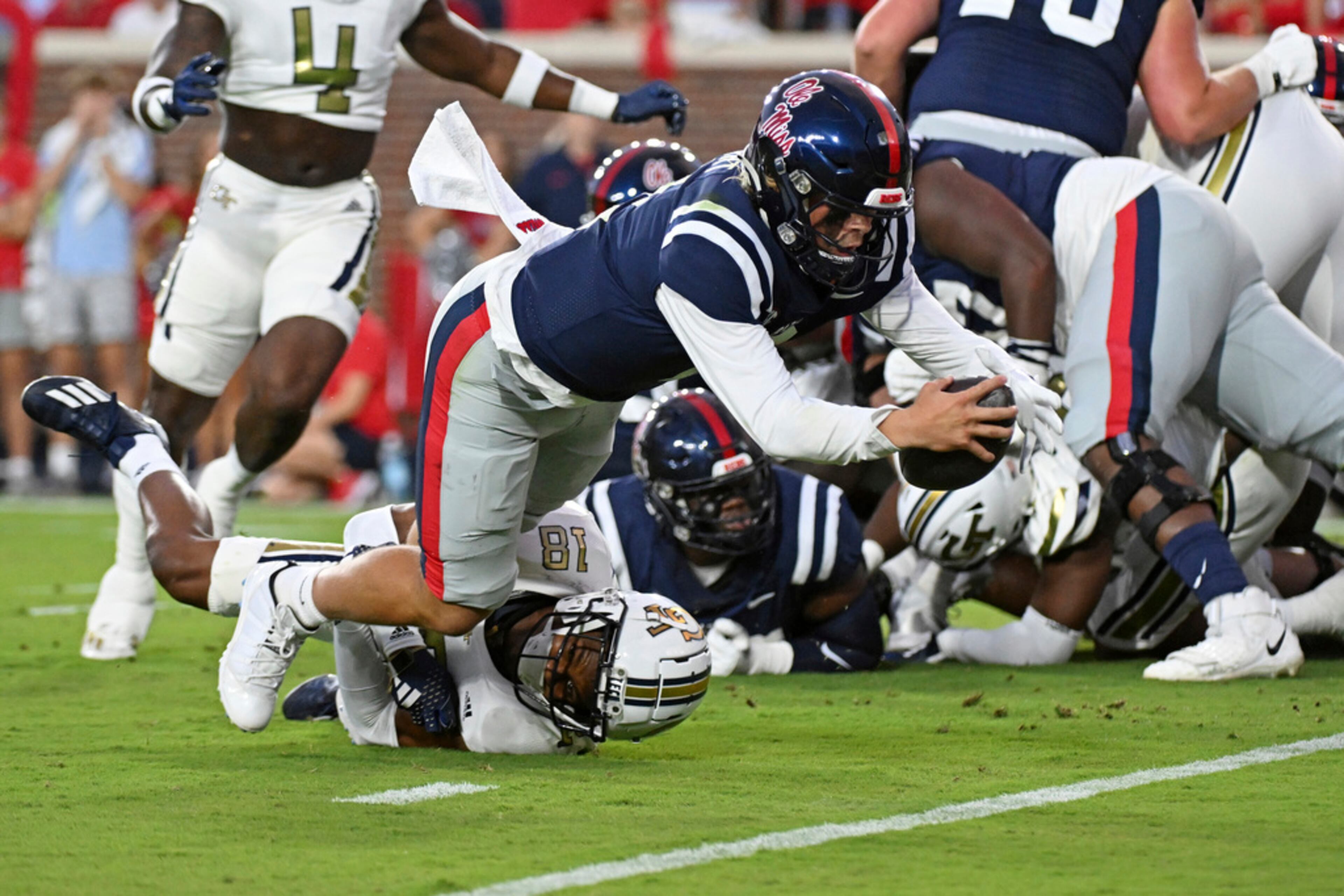 Mississippi quarterback Jaxson Dart (2) dives for a touchdown past Georgia Tech defensive back Ahmari Harvey (18) during the first half an NCAA college football game in Oxford, Miss., Saturday, Sept. 16, 2023. (AP Photo/Thomas Graning)