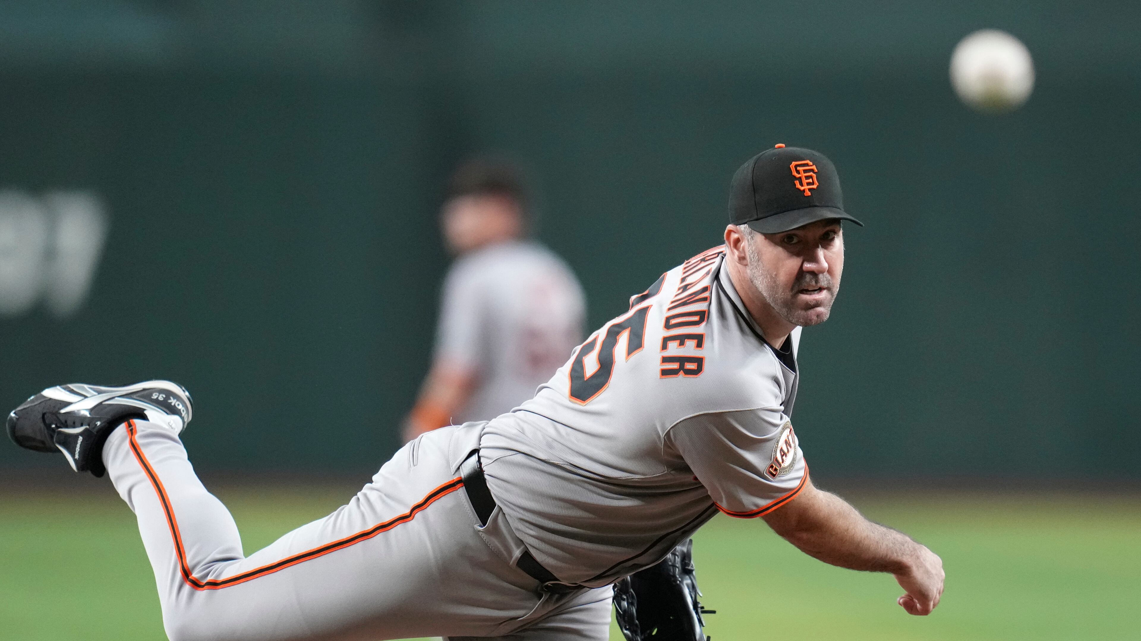 FILE - San Francisco Giants starting pitcher Justin Verlander warms up during the first inning of a baseball game against the Arizona Diamondbacks Wednesday, Sept. 17, 2025, in Phoenix. (AP Photo/Ross D. Franklin, File)
