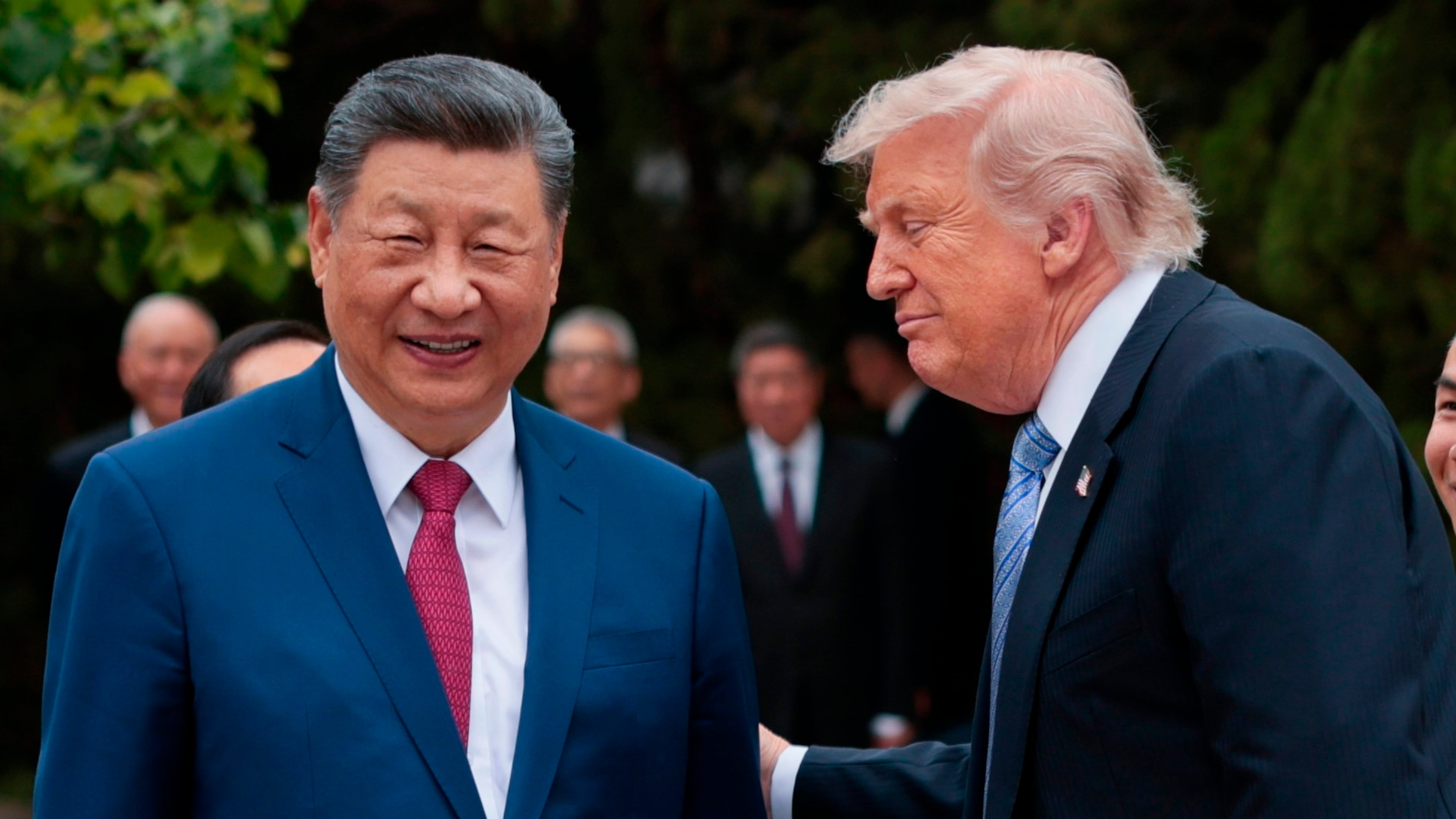 U.S. President Donald Trump, right, speaks with Chinese President Xi Jinping while leaving after a visit to the Zhongnanhai Garden in Beijing, Friday, May 15, 2026. (Evan Vucci/Pool Photo via AP)