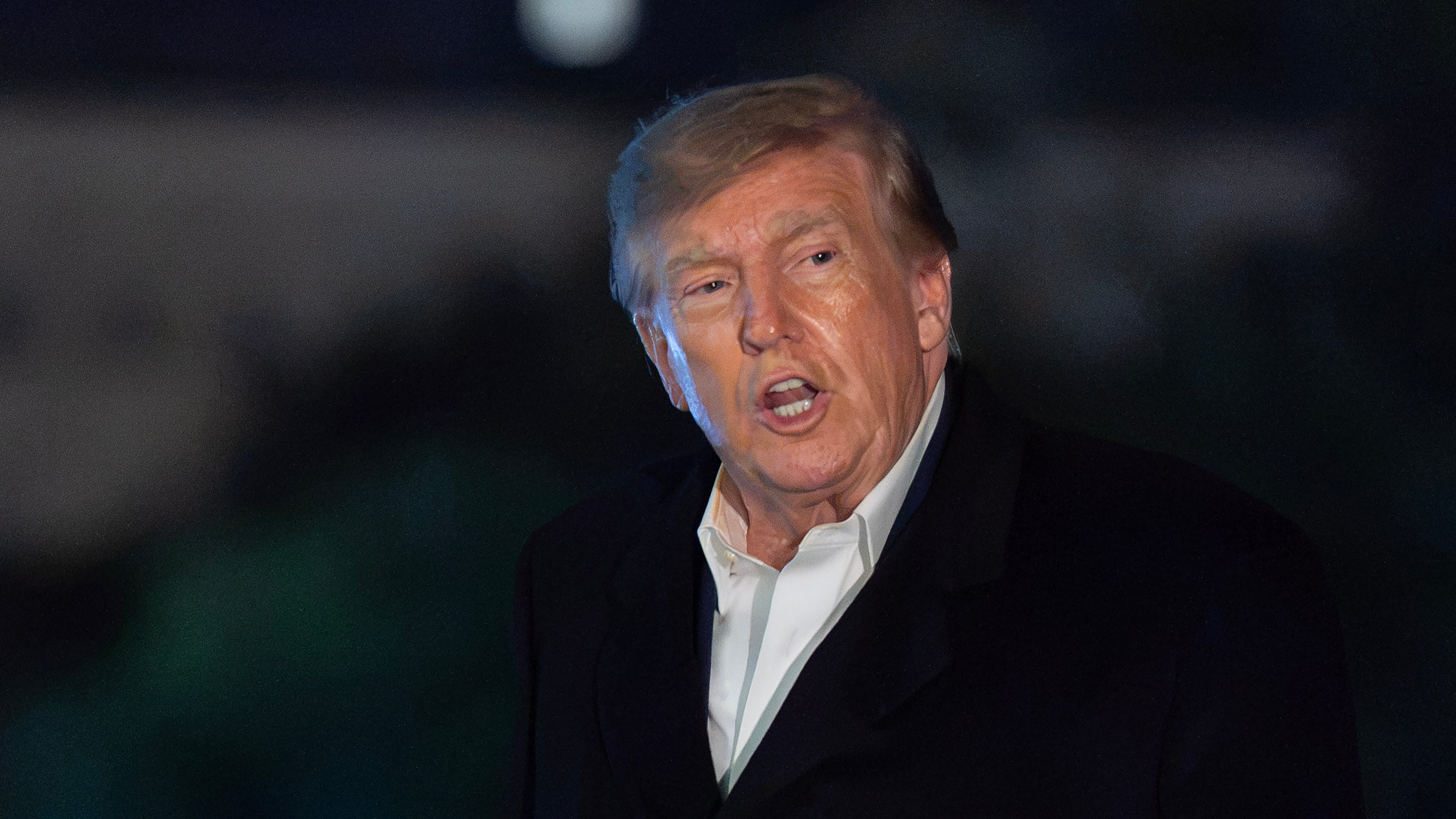 President Donald Trump talks to reporters as he walks on the South Lawn upon his arrival to the White House, Tuesday, Oct. 20, 2026, in Washington. (AP Photo/Jose Luis Magana)