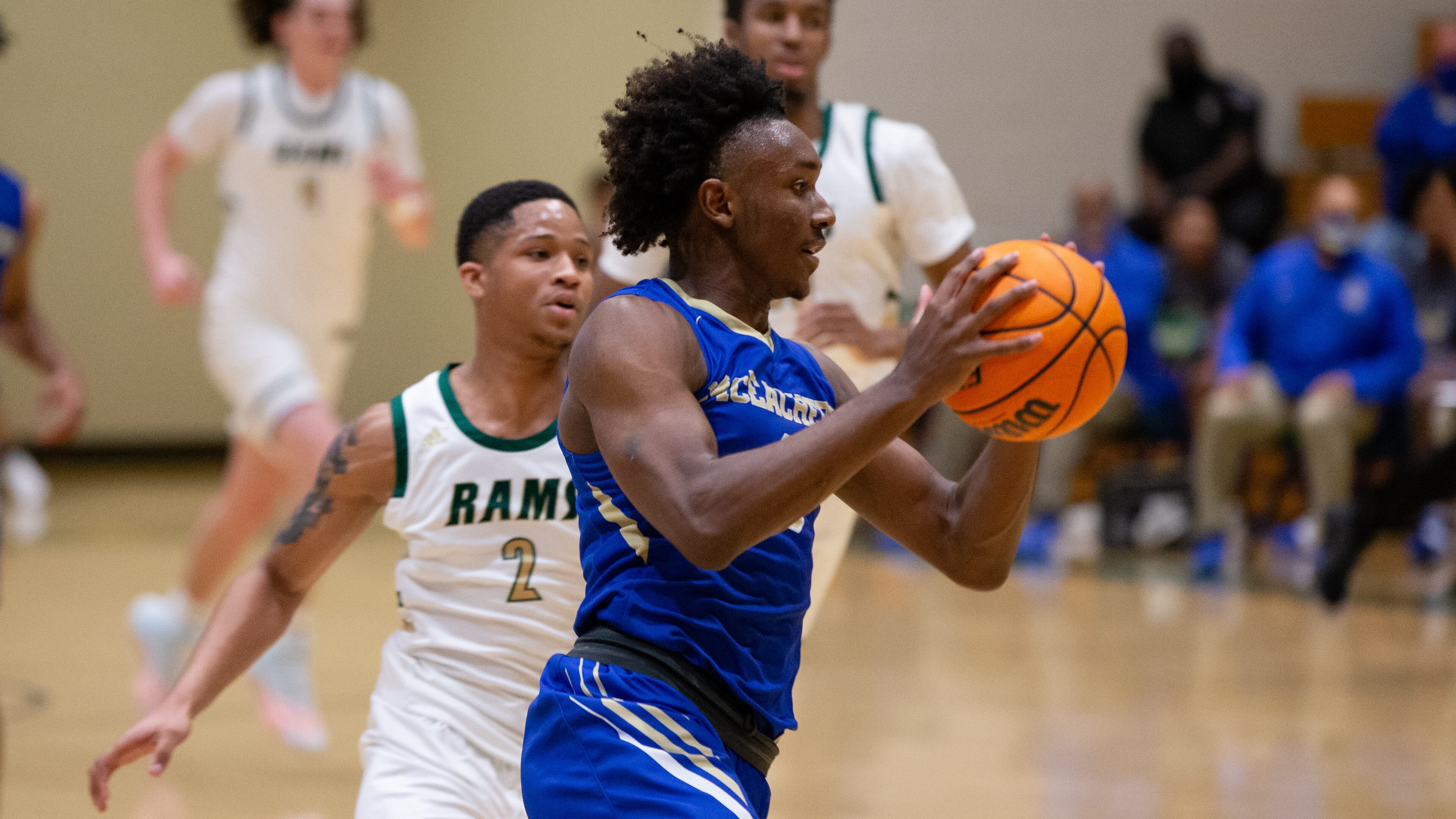 Chance Moore (0), small forward for McEachern, dribbles down the court pursued by Tyrese Elliot (2), guard for Grayson, during the Grayson vs. McEachern high school boys basketball playoff game on Saturday, February 27, 2021, at Grayson High School in Loganville, Georgia. McEachern defeated Grayson 57-56 in overtime. CHRISTINA MATACOTTA FOR THE ATLANTA JOURNAL-CONSTITUTION