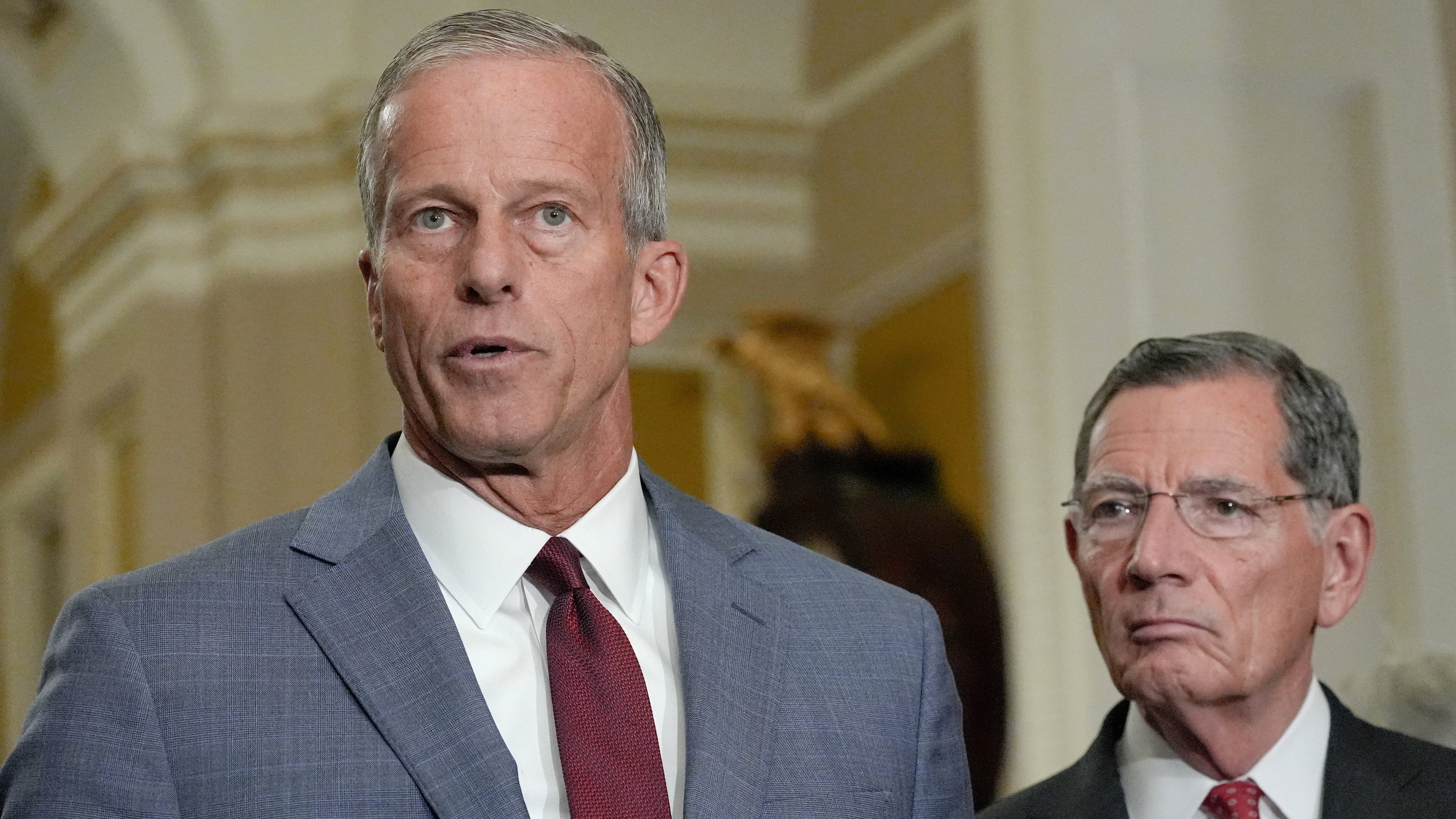 Sen. Majority Leader John Thune, R-S.D., left, speaks as Sen. John Barrasso, R-Wyo., listens during a news conference after a policy luncheon on Capitol Hill, Wednesday, July 29, 2026, in Washington. (AP Photo/Mariam Zuhaib)