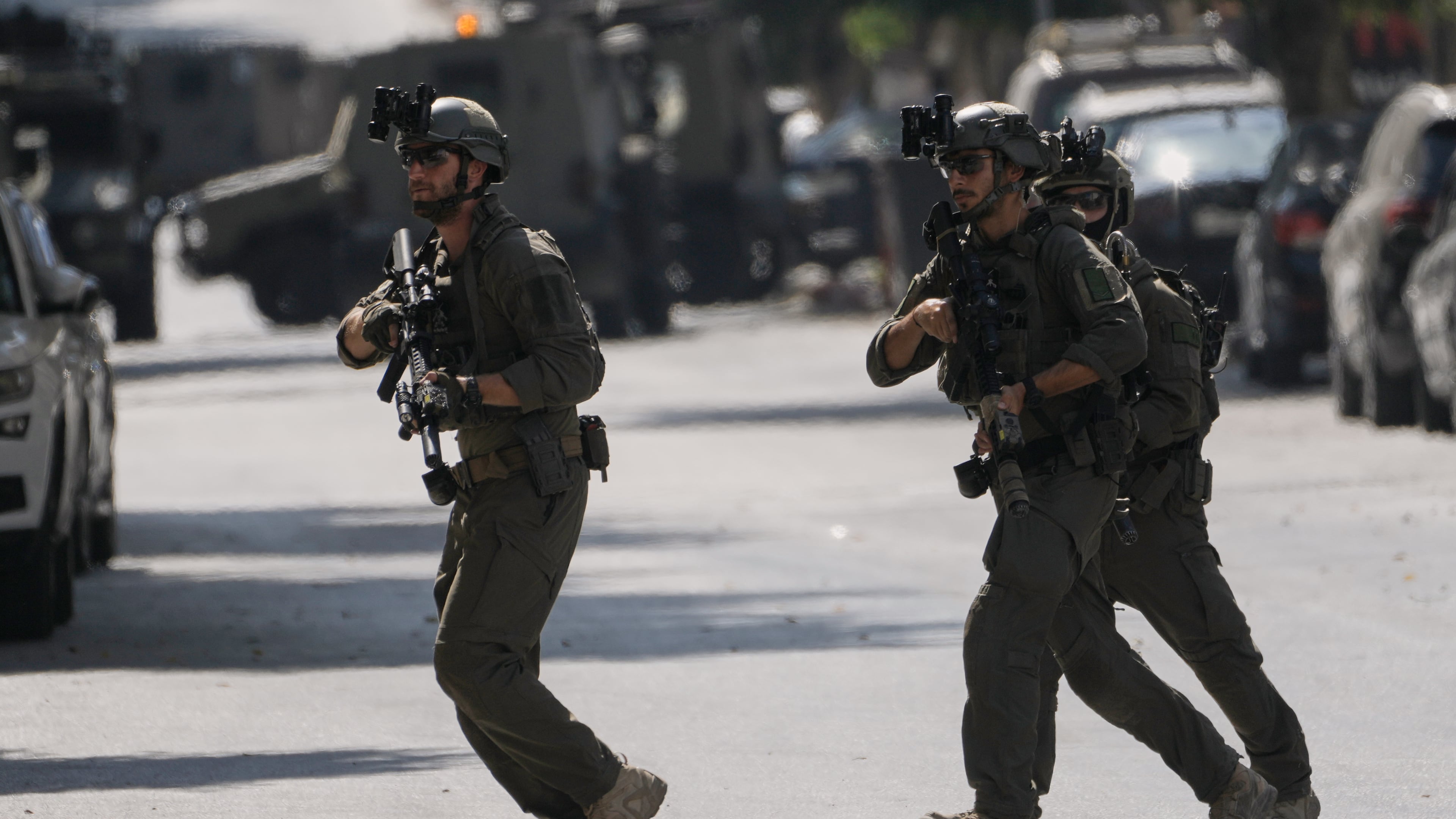 Israeli soldiers move on a street outside the Nablus Speciality Hospital in the West Bank city of Nablus, Friday, July 24, 2026, after Israeli military killed, according to health authorities, at least four Palestinians in the village of Tell in the northern West Bank. (AP Photo/Majdi Mohammed)