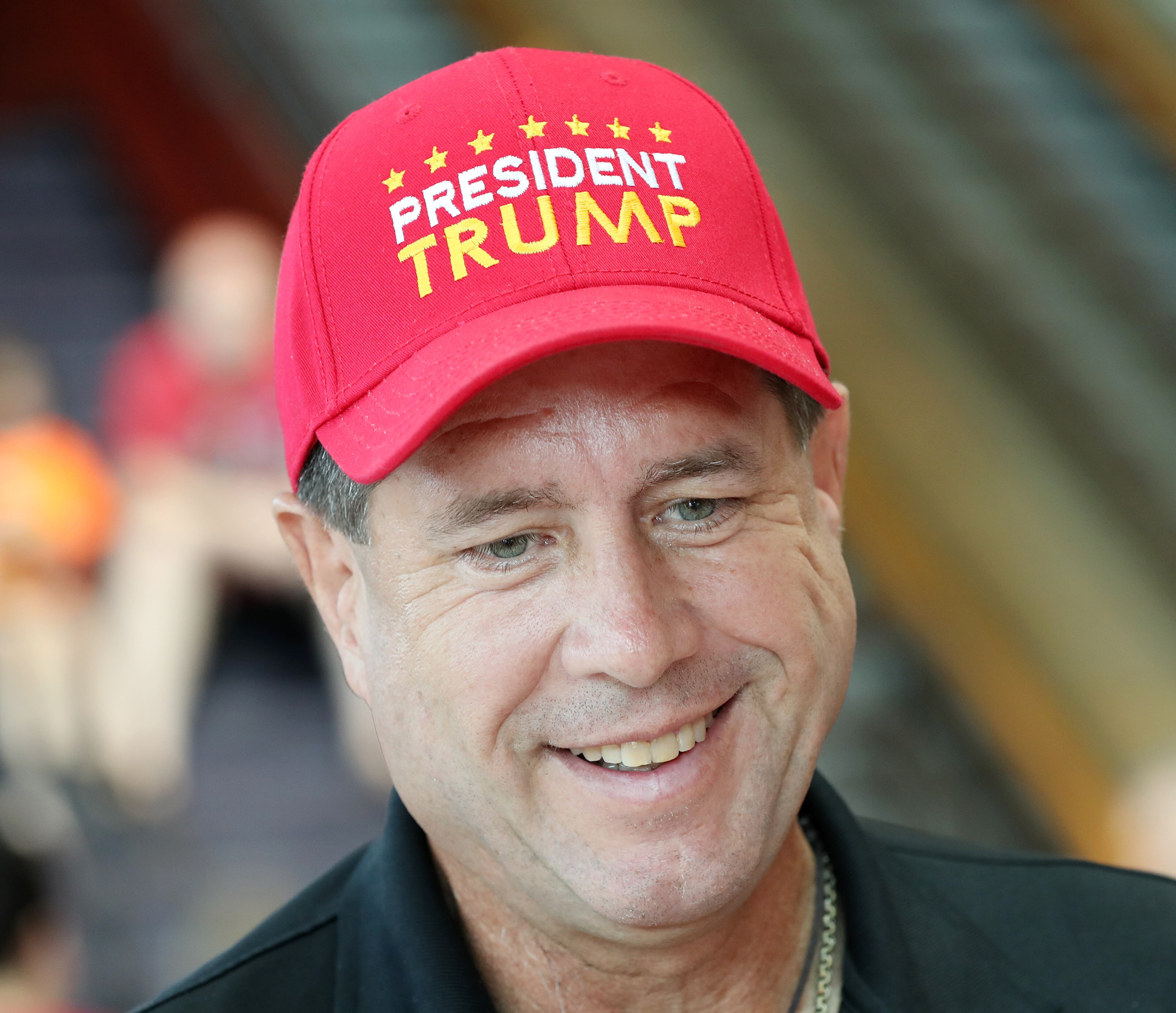 Jeff Martin sports a President Trump hat during Republican Vice Presidential nominee Mike Pence's campaign stop in Marietta. Curtis Compton /ccompton@ajc.com