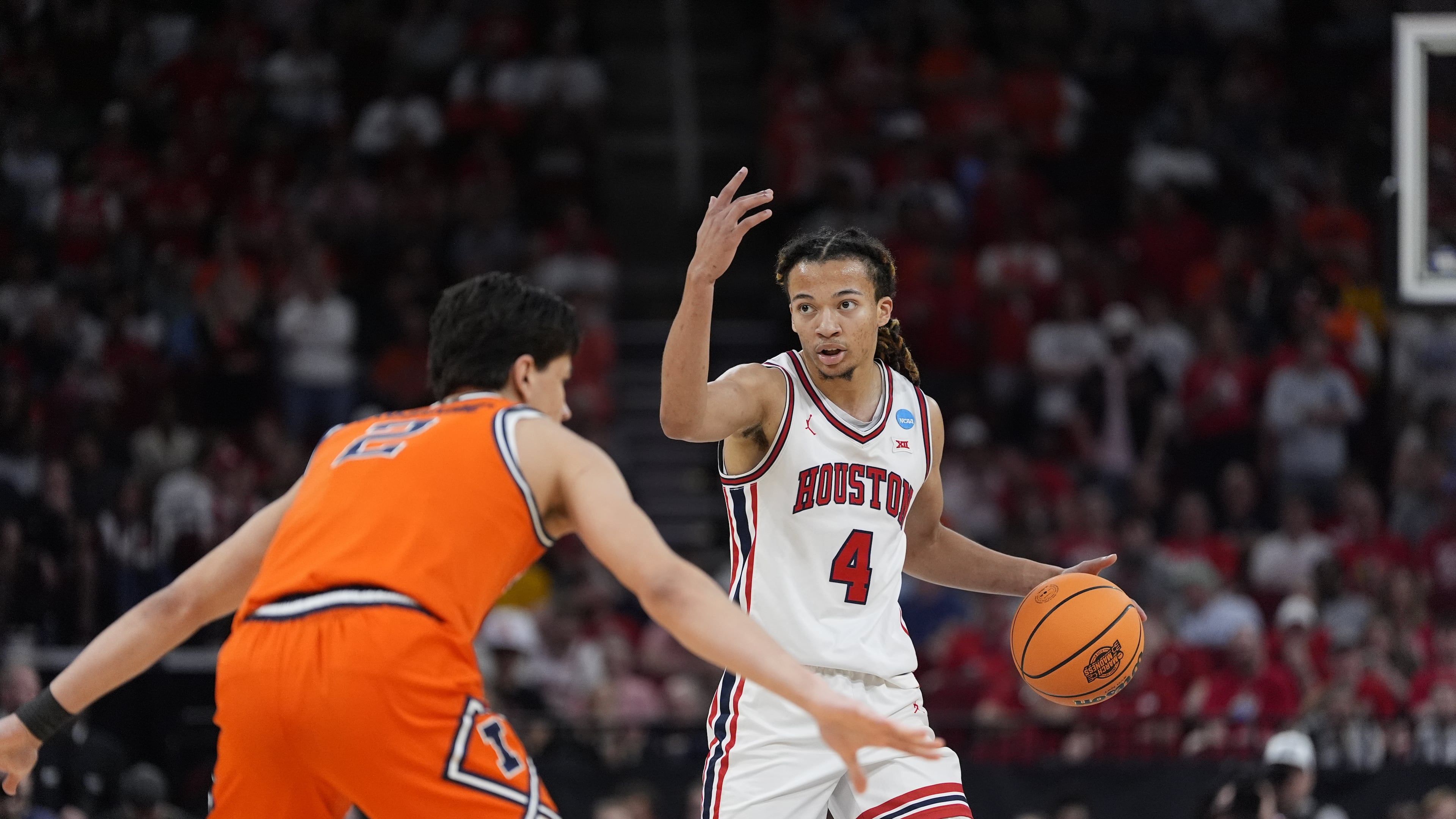 Houston guard Kingston Flemings (4) directs his teammates during the first half of a Sweet 16 game in the NCAA college basketball tournament Thursday, March 26, 2026, in Houston. (Ashley Landis/AP)