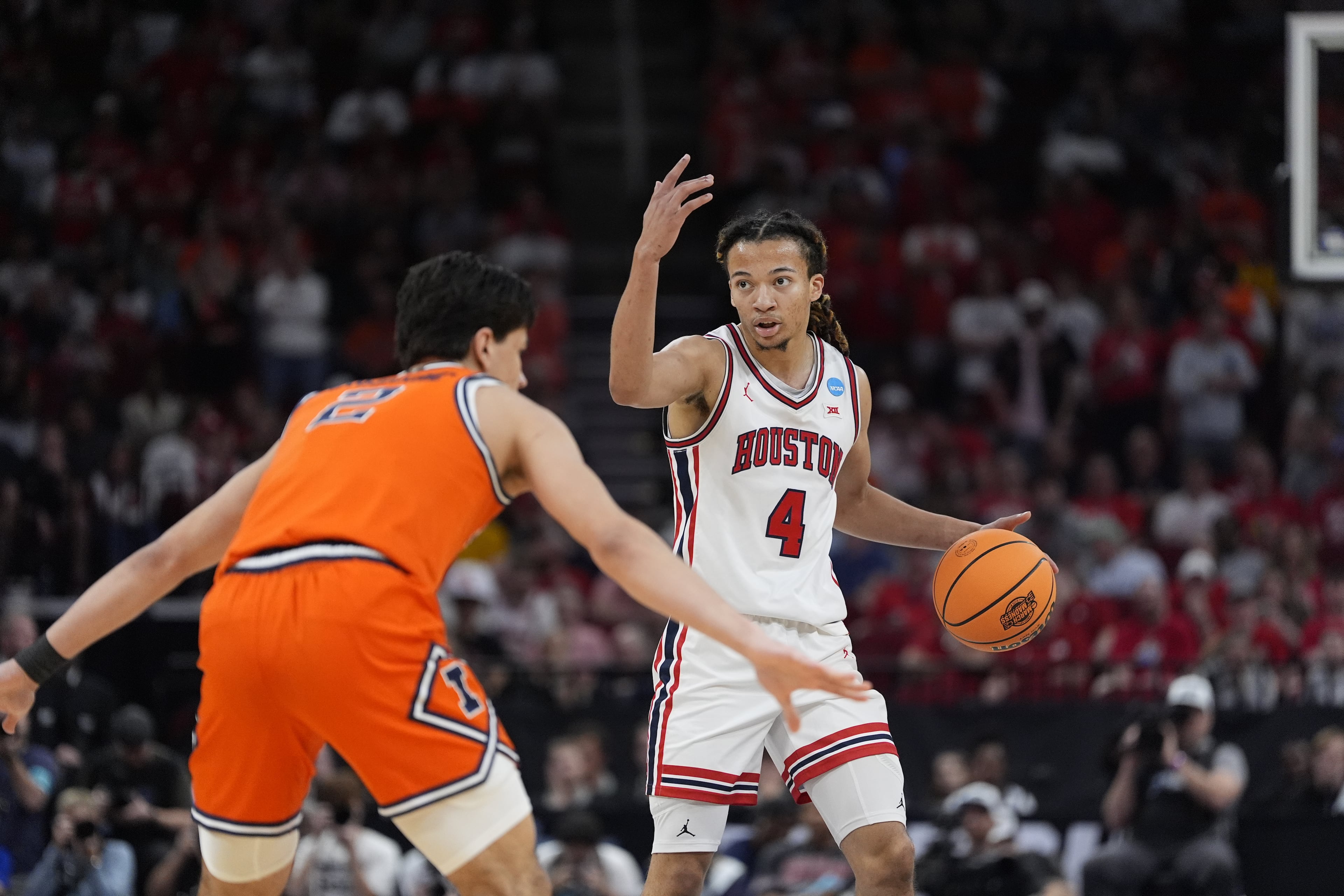 Houston guard Kingston Flemings (4) directs his teammates during the first half of a Sweet 16 game in the NCAA college basketball tournament Thursday, March 26, 2026, in Houston. (Ashley Landis/AP)