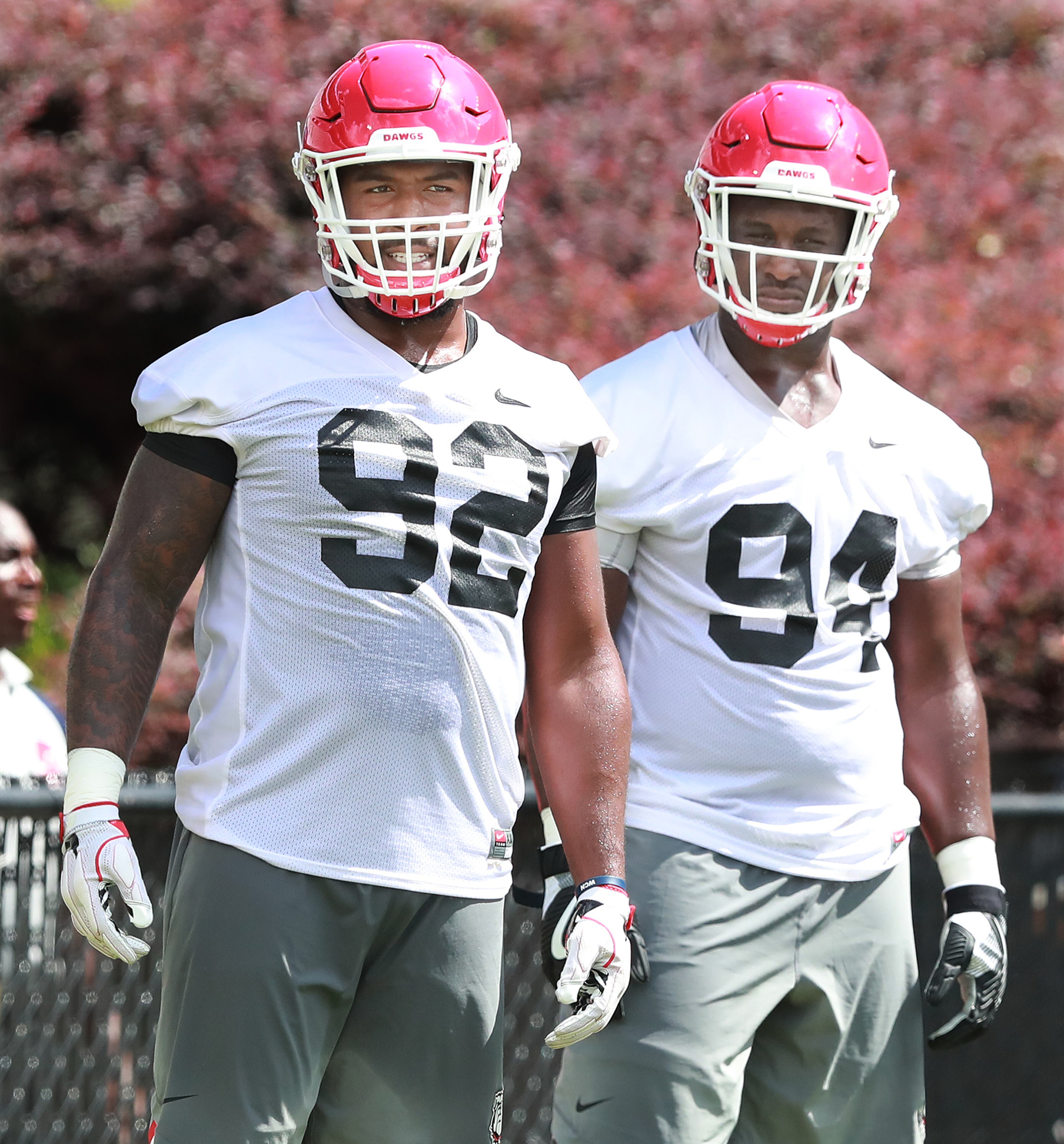 August 4, 2018 Athens: Georgia defensive end Justin Young (left) and defensive tackle Michael Barnett get in some work during team practice at Fan Day on Saturday, August 4, 2018, in Athens. Curtis Compton/ccompton@ajc.com