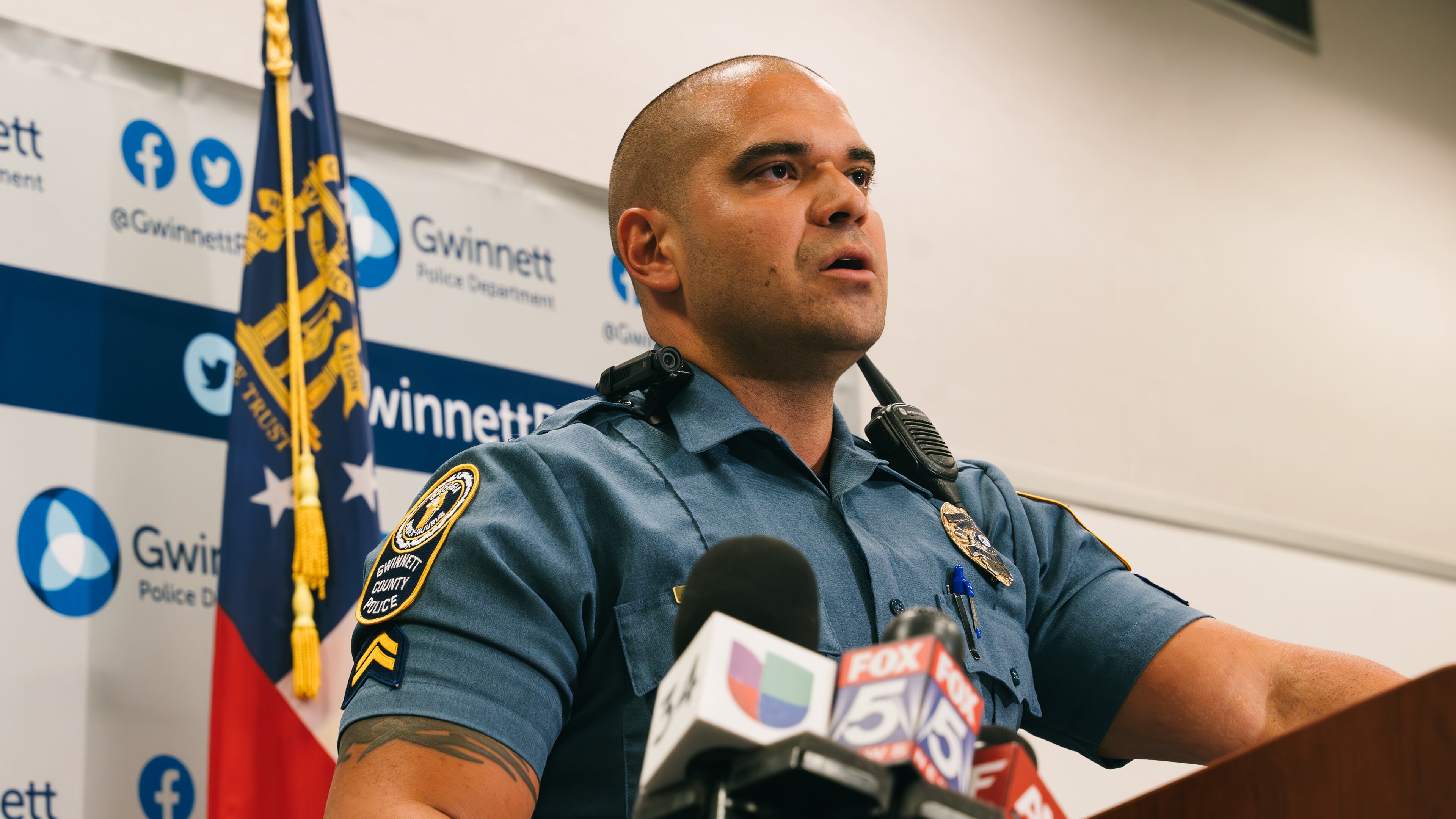 Gwinnett County police Cpl. Juan Madiedo provides updates Thursday afternoon after six suspects were arrested and charged with murder after a woman's body was found in a trunk.