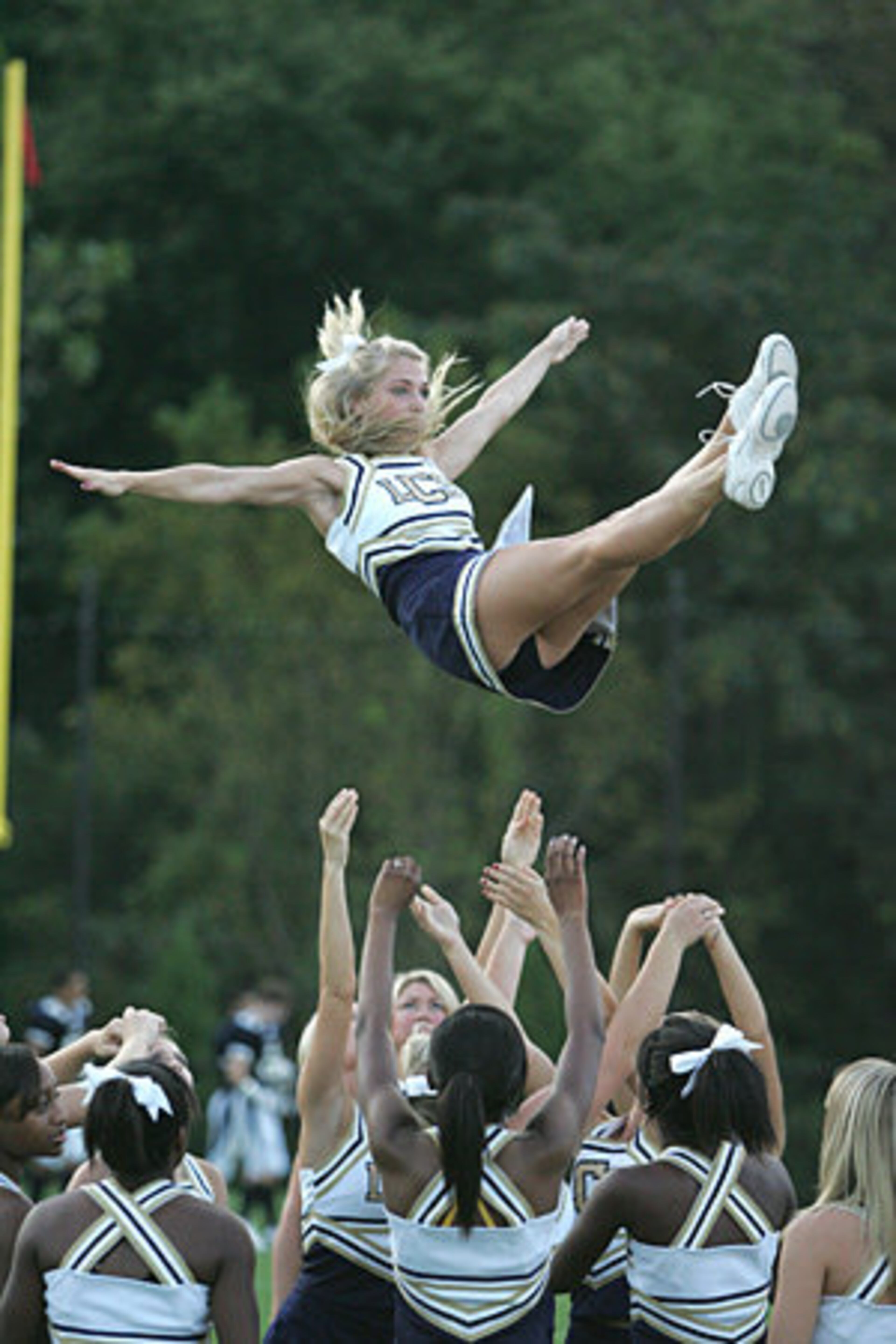 Landmark Christian cheerleader Leah Skinner gets airborne during a routine.