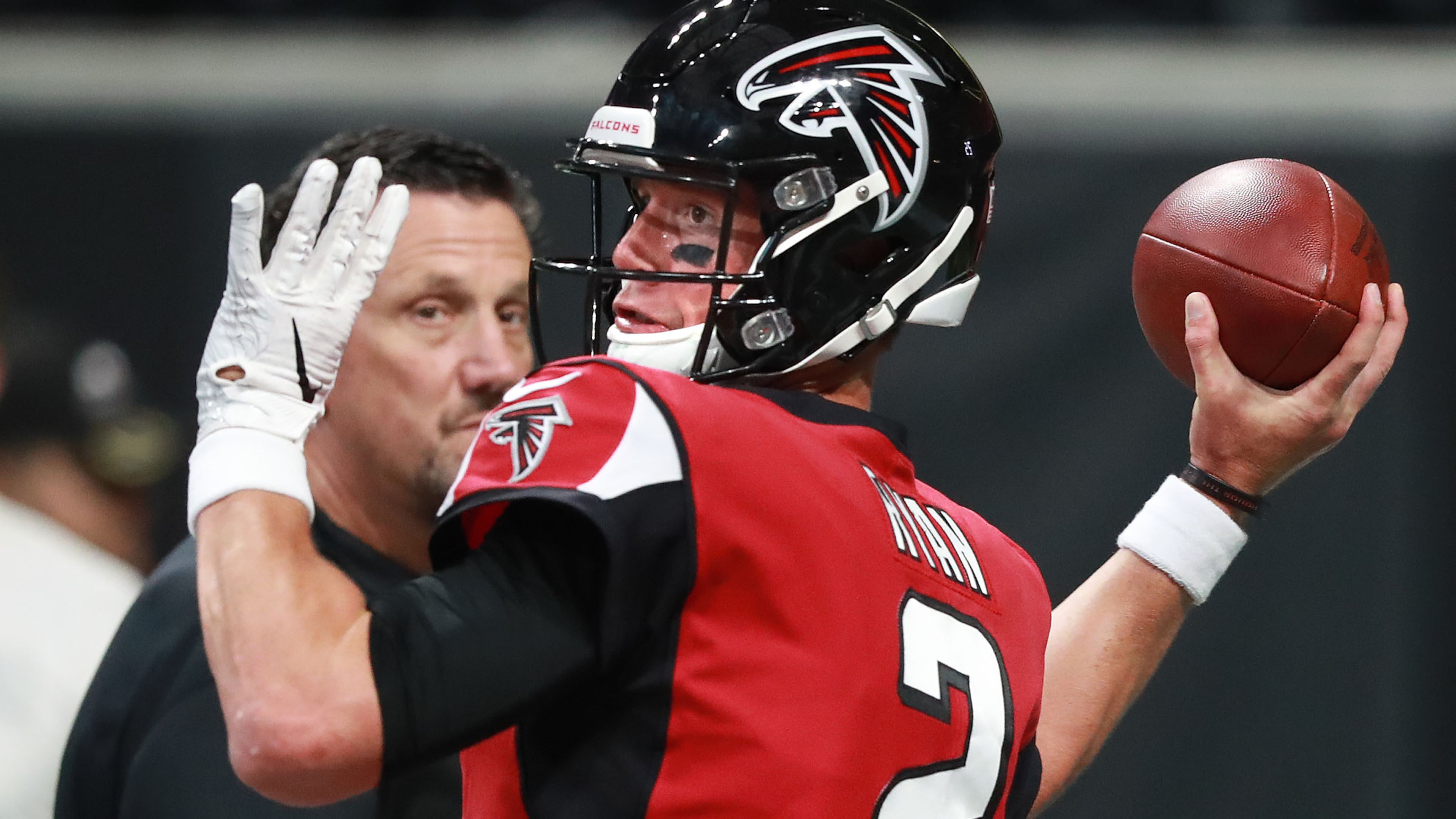 Atlanta Falcons passing game coordinator Greg Knapp looks on as quarterback Matt Ryan prepares to play the Kansas City Chiefs Friday, Aug. 17, 2018, at Mercedes-Benz Stadium in Atlanta.