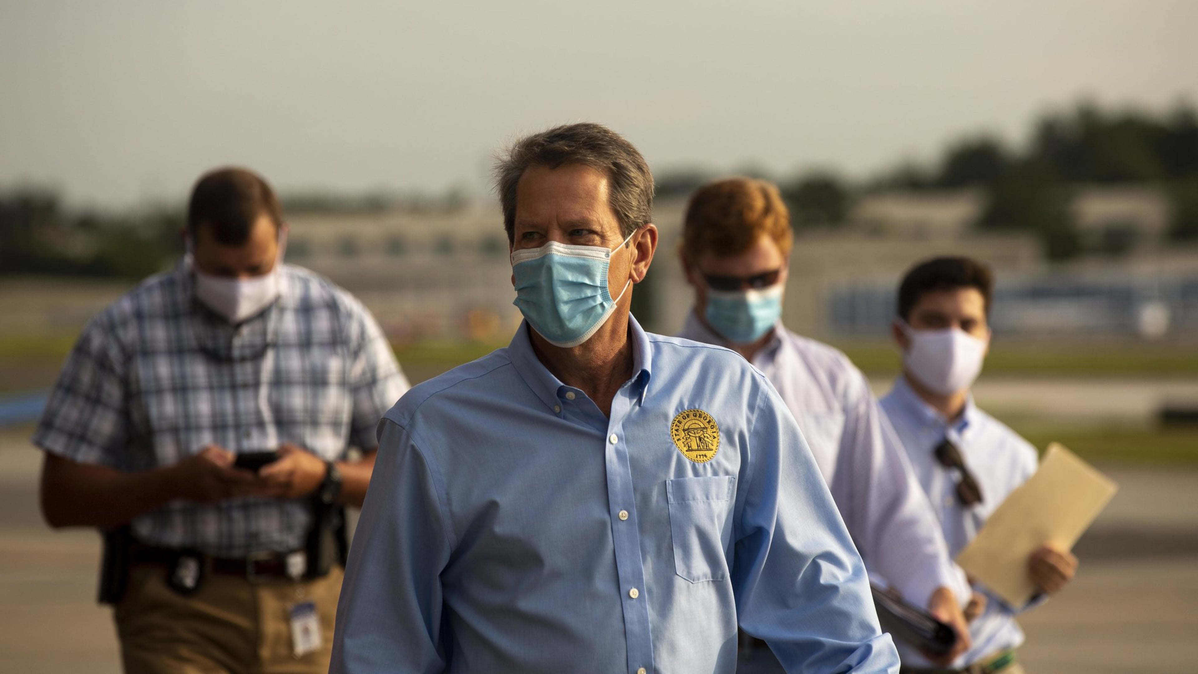 Georgia Gov. Brian Kemp prepares to speak at the start of a “Wear A Mask” tour. (REBECCA WRIGHT FOR THE ATLANTA JOURNAL-CONSTITUTION)