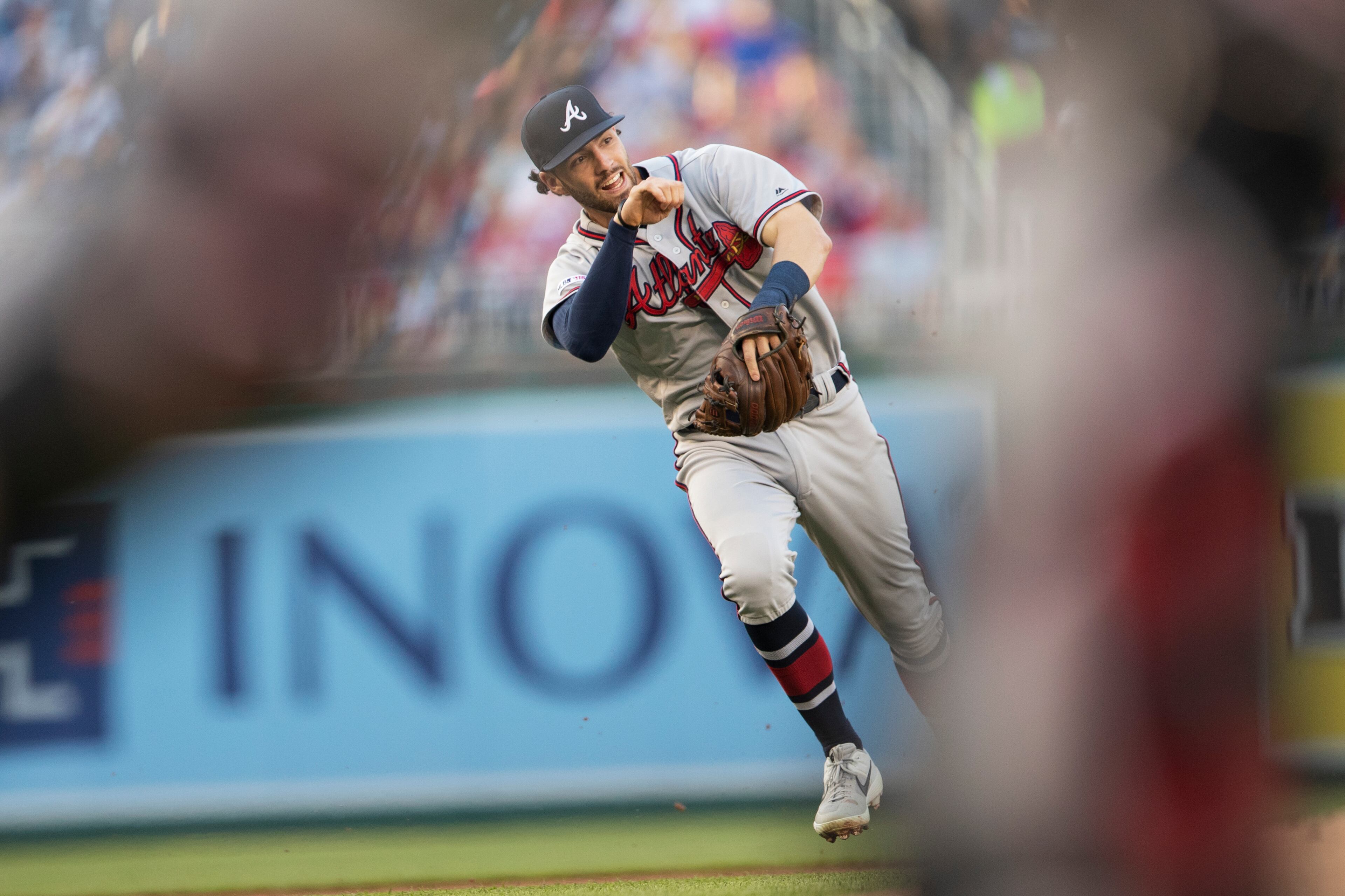 Atlanta Braves shortstop Dansby Swanson throws the ball to first as Washington Nationals Juan Soto runs to beat the throw during the first inning of a baseball game in Washington, Friday, June 21, 2019. Soto grounded out to second. (AP Photo/Manuel Balce Ceneta)