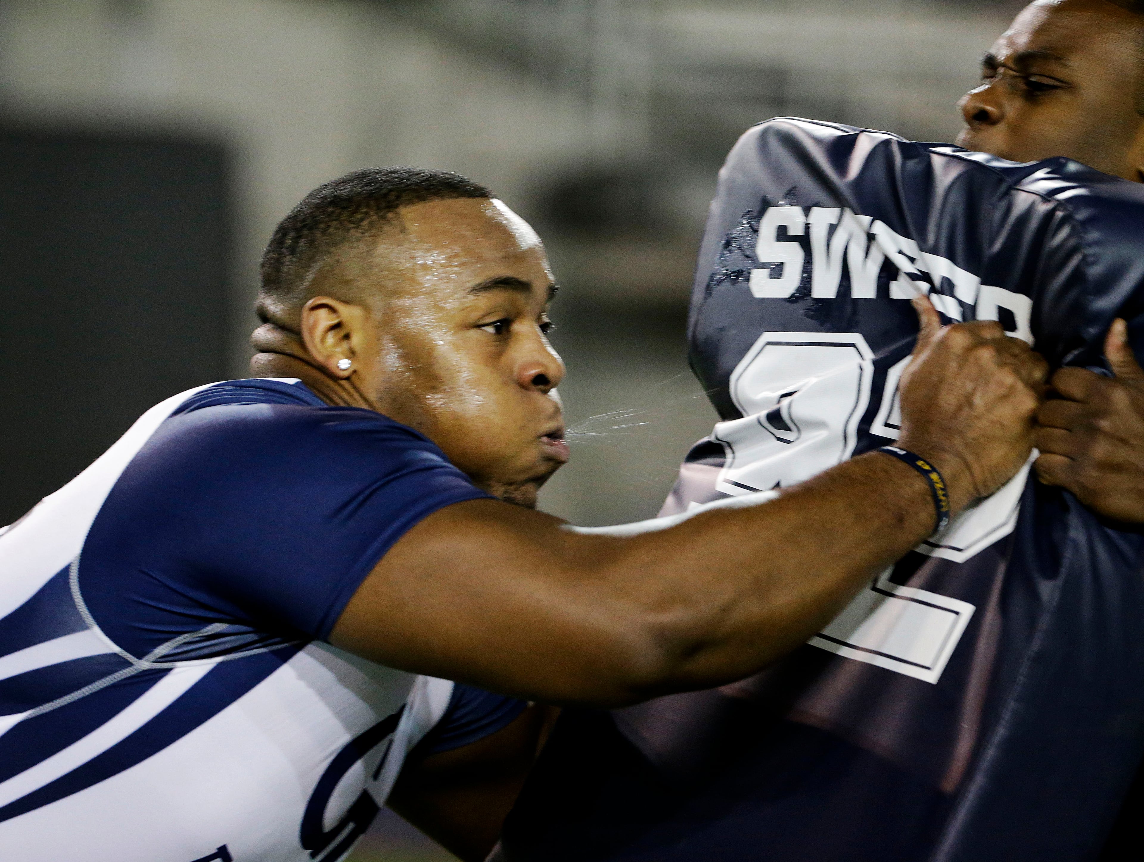 Shaquille Mason, left, runs a football drill with strength conditioning intern Tevone Allen during NFL Pro Day at Georgia Tech Friday, March 13, 2015, in Atlanta. (AP Photo/David Goldman)