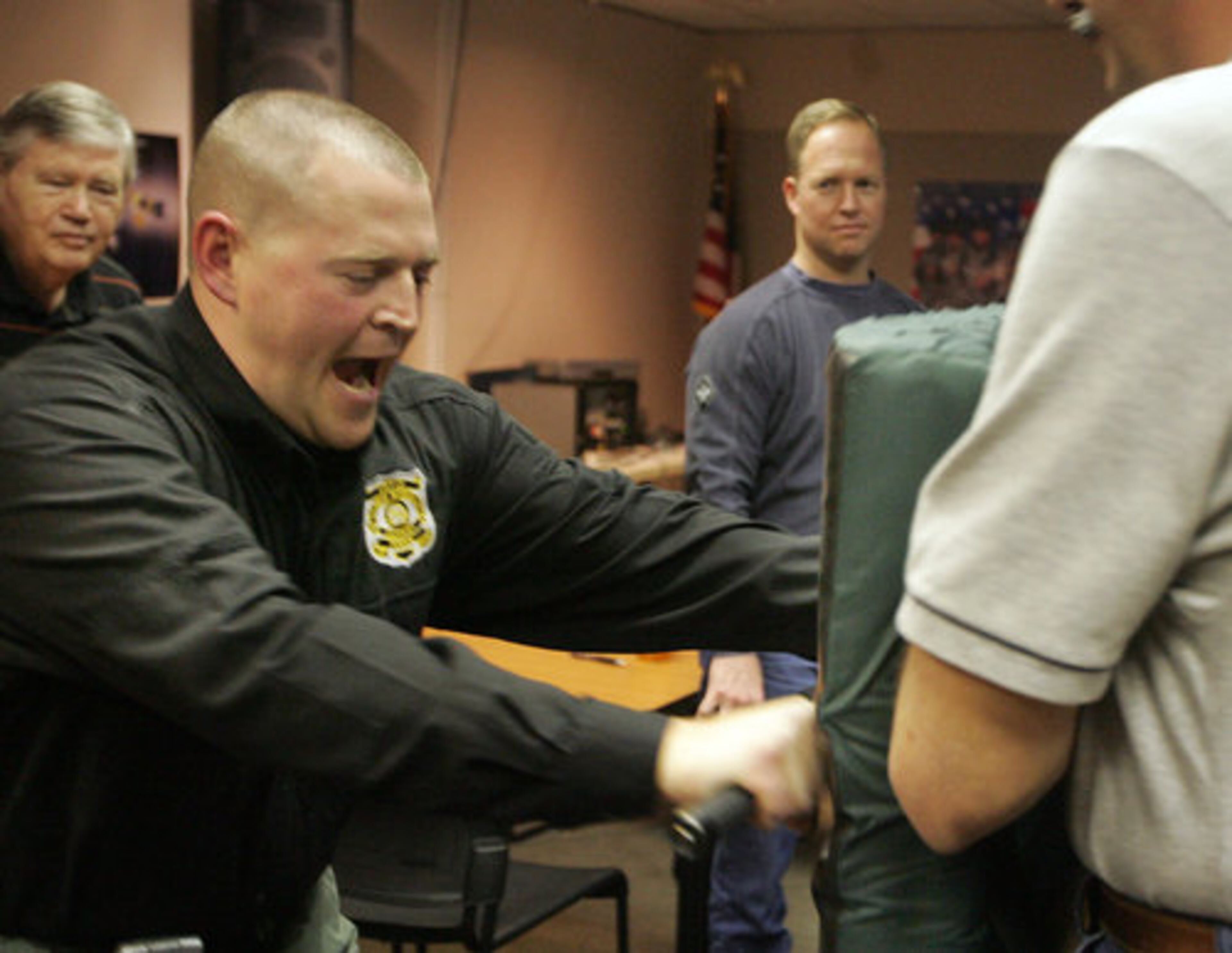 Emmett demonstrates a self defense tactic using a baton.
